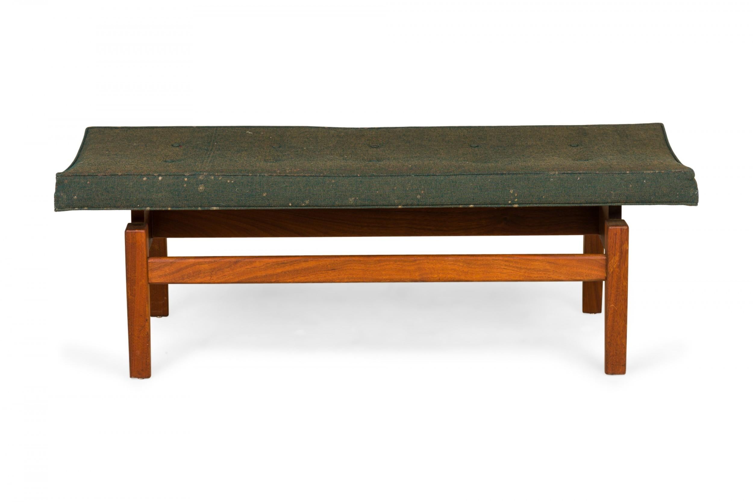 Danish Mid-Century rectangular floating bench with a green fabric upholstered seat resting on a wooden floating frame base. (JENS RISOM).
 