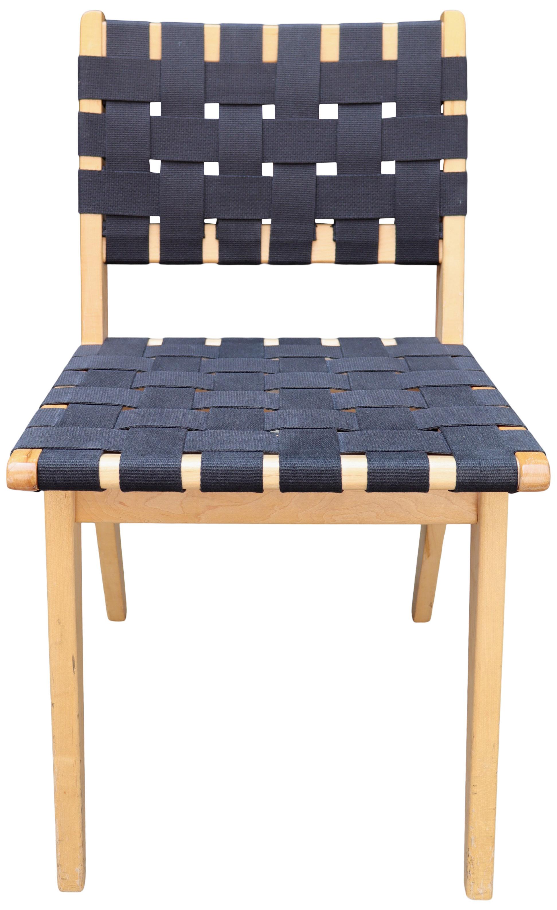 Knoll Jens Risom chairs. 
Simple classic and honest design made this side or dining chair so popular that its still in production today. Made from solid maple wood and black cotton strapping. 

  