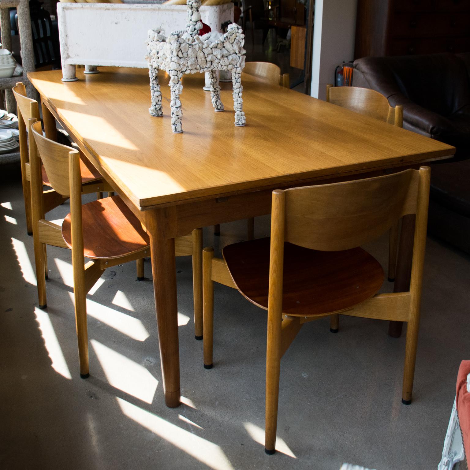 By influential Danish designer Jens Risom. Substantial and comfortable midcentury chairs with bentwood seats and backs. Dining height. Unique stacking chairs.