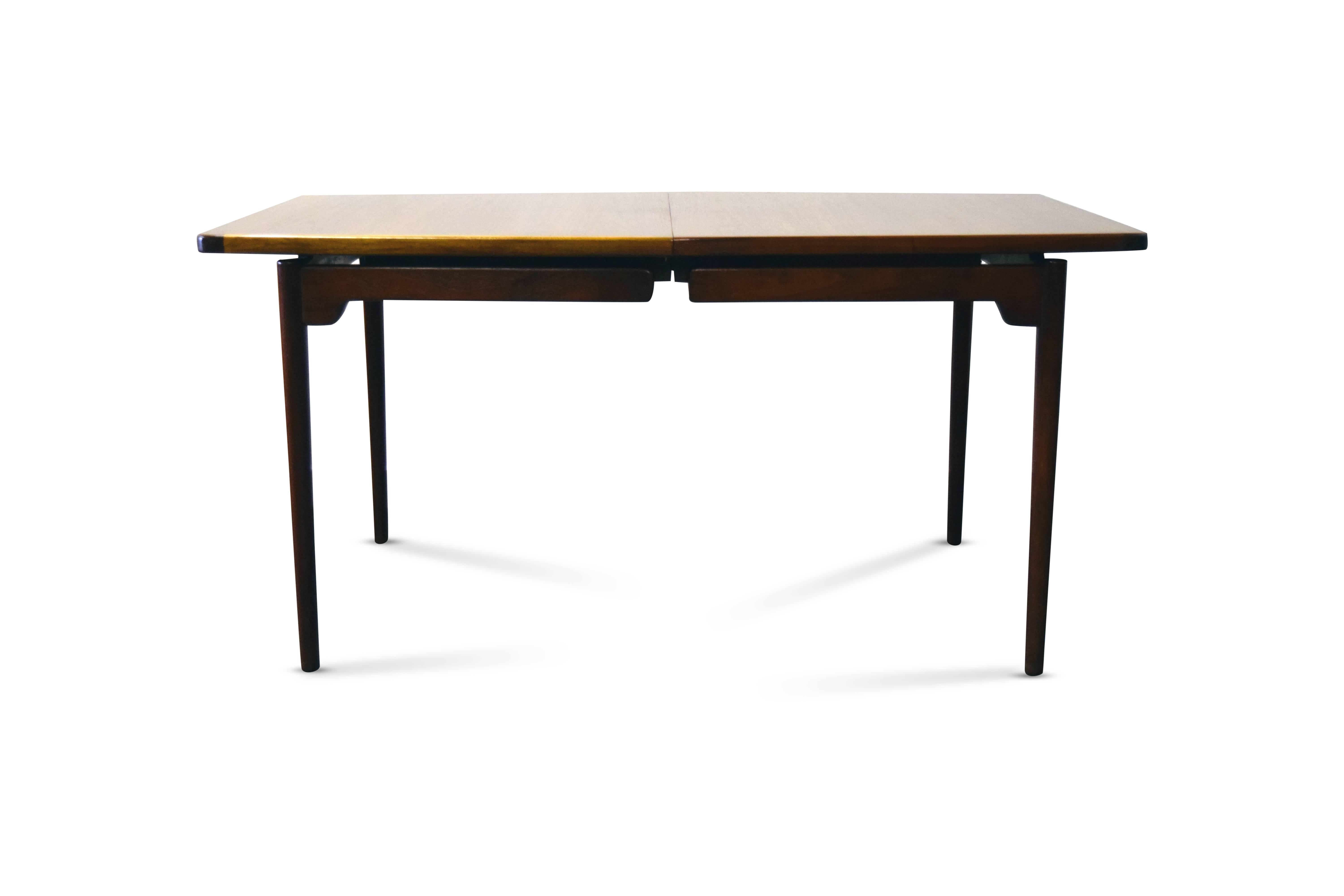 Jens Risom dining table 

Measures: Has 2 leaves; to make 96