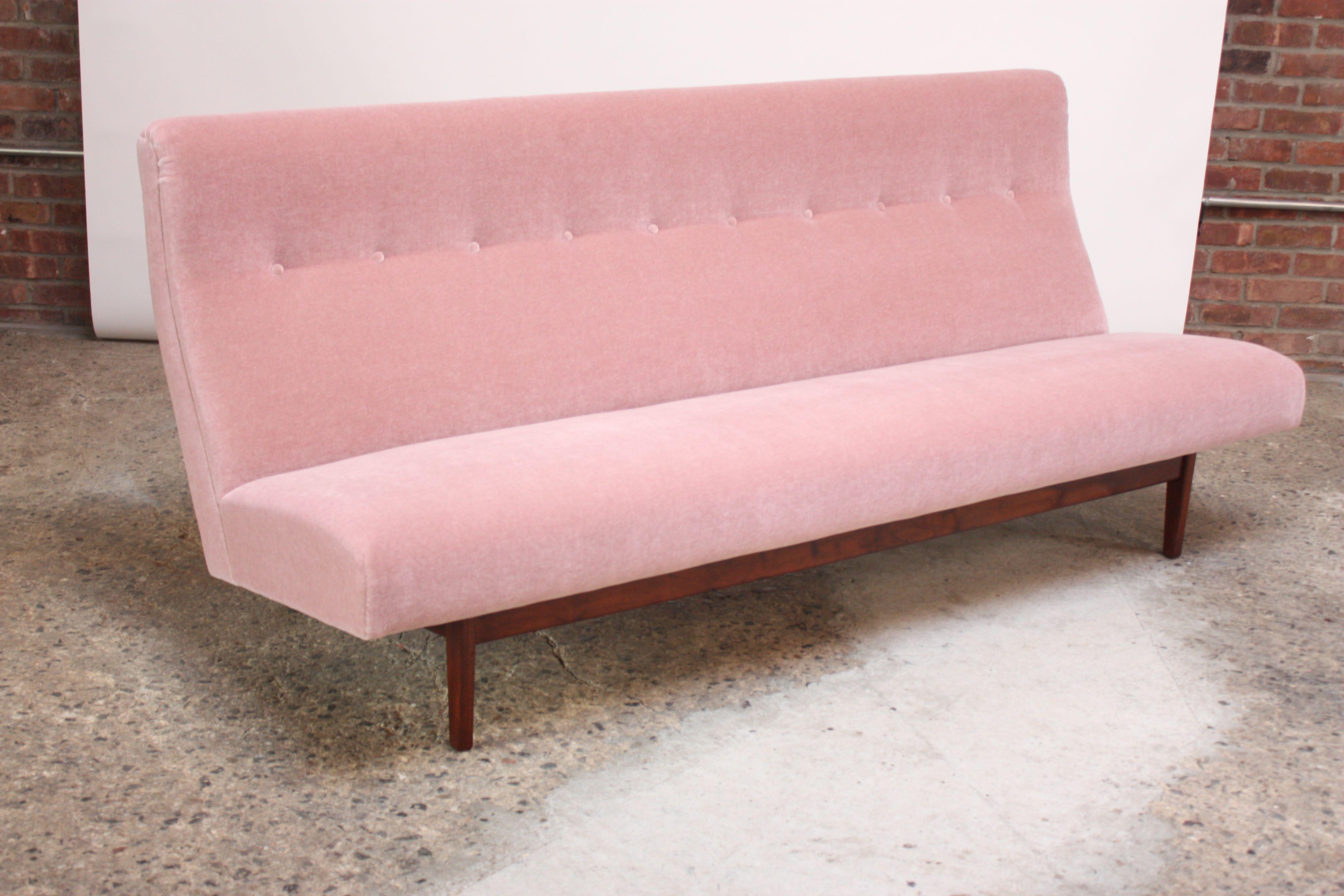 Three-seat sofa, Model #U250, designed by Jens Risom for Risom Design in the 1950s.
Composed of a sculptural walnut base on which the tufted, high-back seat is mounted. Pink mohair and foam are new; frame has been refinished.