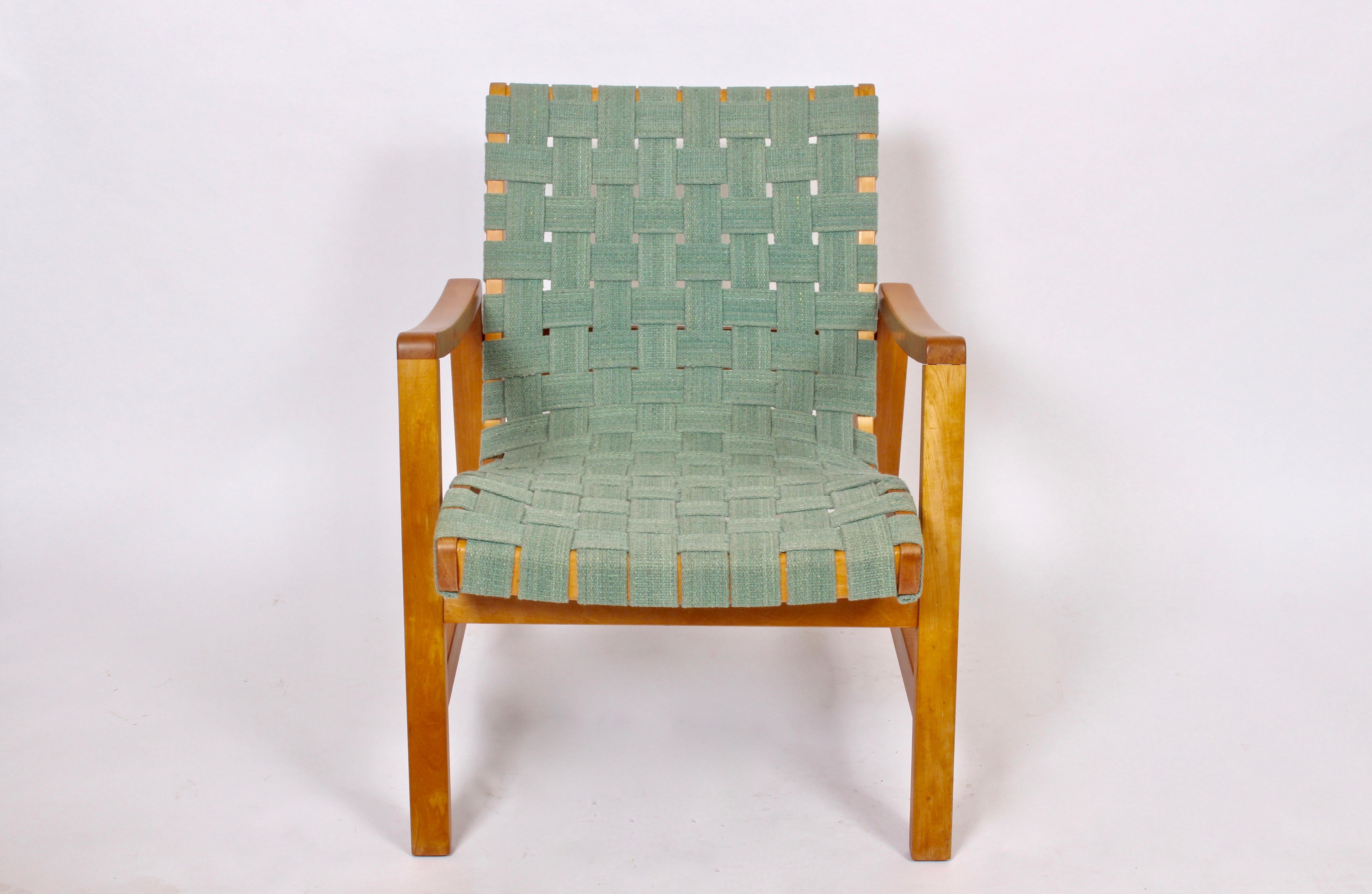 Early Jens Risom for Knoll Associates, Inc. Maple armchair with woven straps. Featuring Maple framework with newly woven straps in Pale Green. 2 pieces. With early Knoll label to frame. Designed 1943. As seen in the permanent collection of the