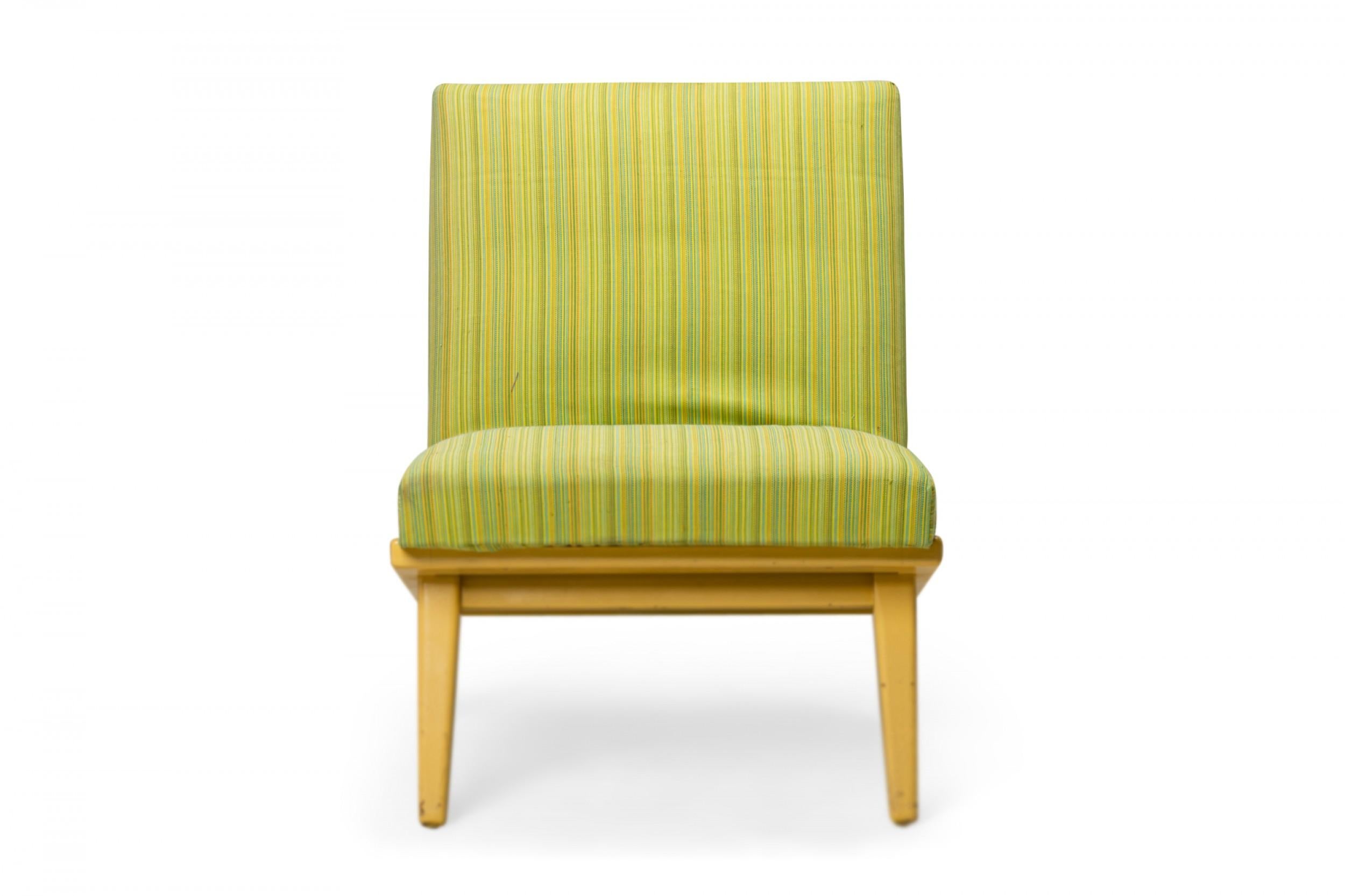 Mid-Century Modern slipper / side chair with faintly striped lime green fabric upholstery, resting on an angled blonde wood base with angled and tapered legs. (Jens Risom for Knoll).
  