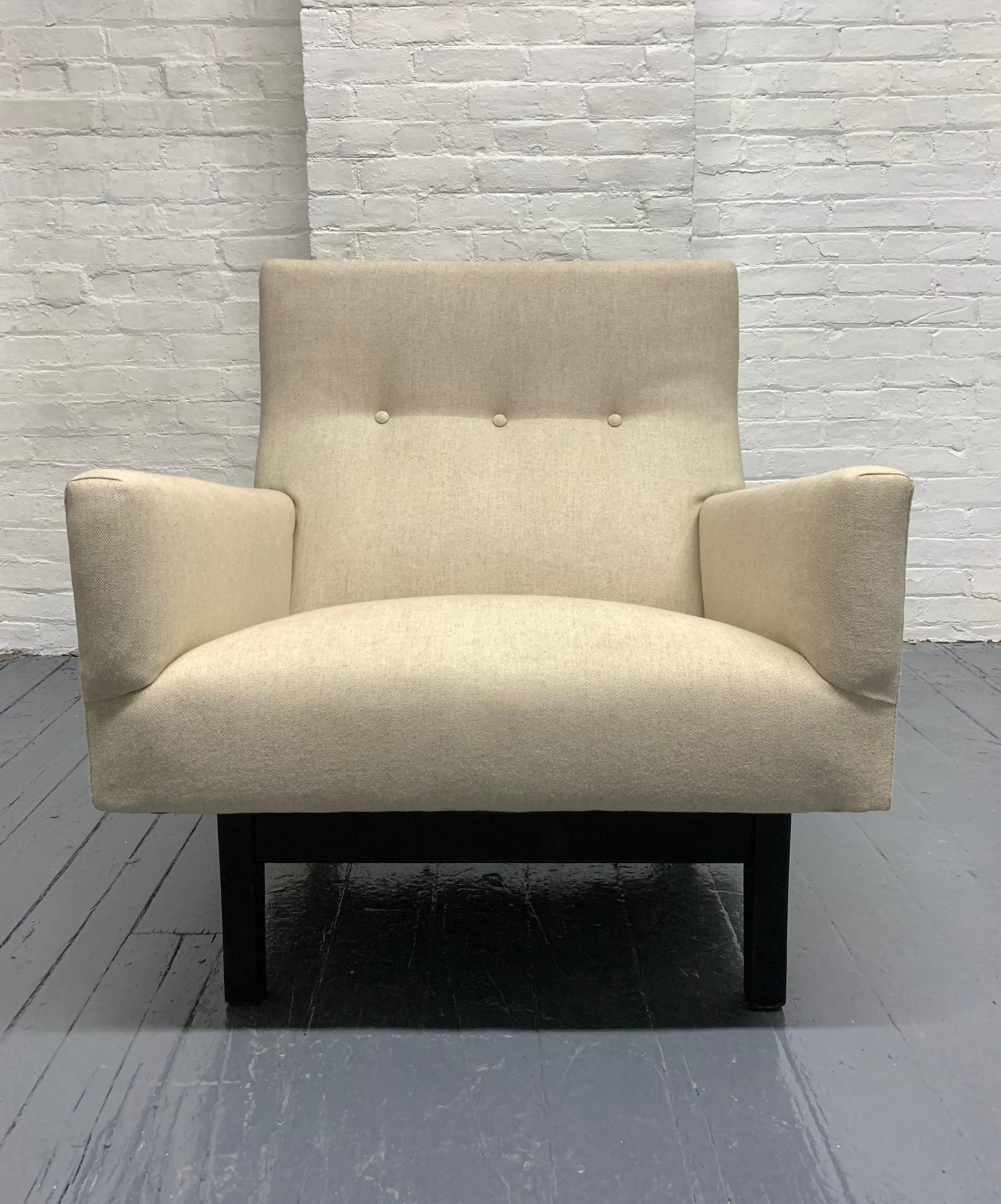Jens Risom lounge chair. Newly upholstered in a linen-blend fabric with a black lacquered base.