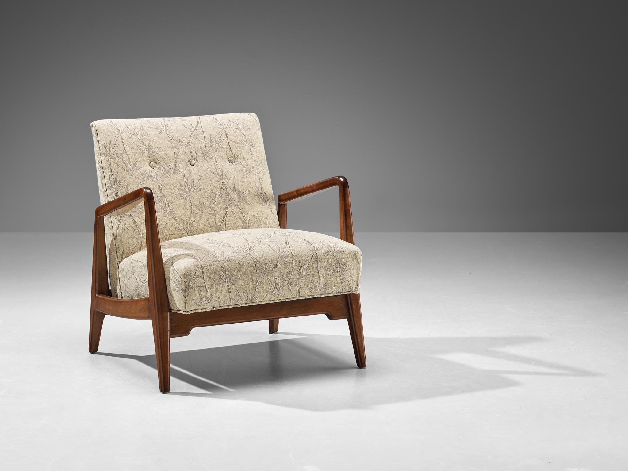 Jens Risom lounge chair, American walnut and bamboo fabric, United States 1960s.

This lounge chair is designed by Danish designer Jens Risom. It is executed in American walnut wood and presents an open arm frame with pointed upwards armrests that
