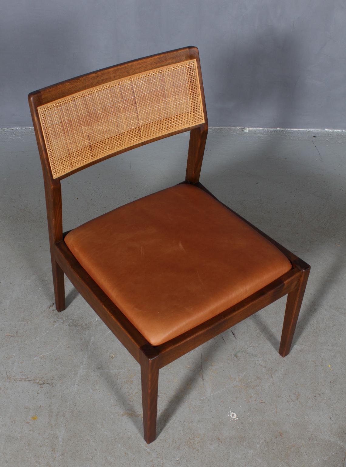 Jens Risom lounge chair in teak. Back with cane.

New upholstered with tan vintage aniline leather. 

Model C240.