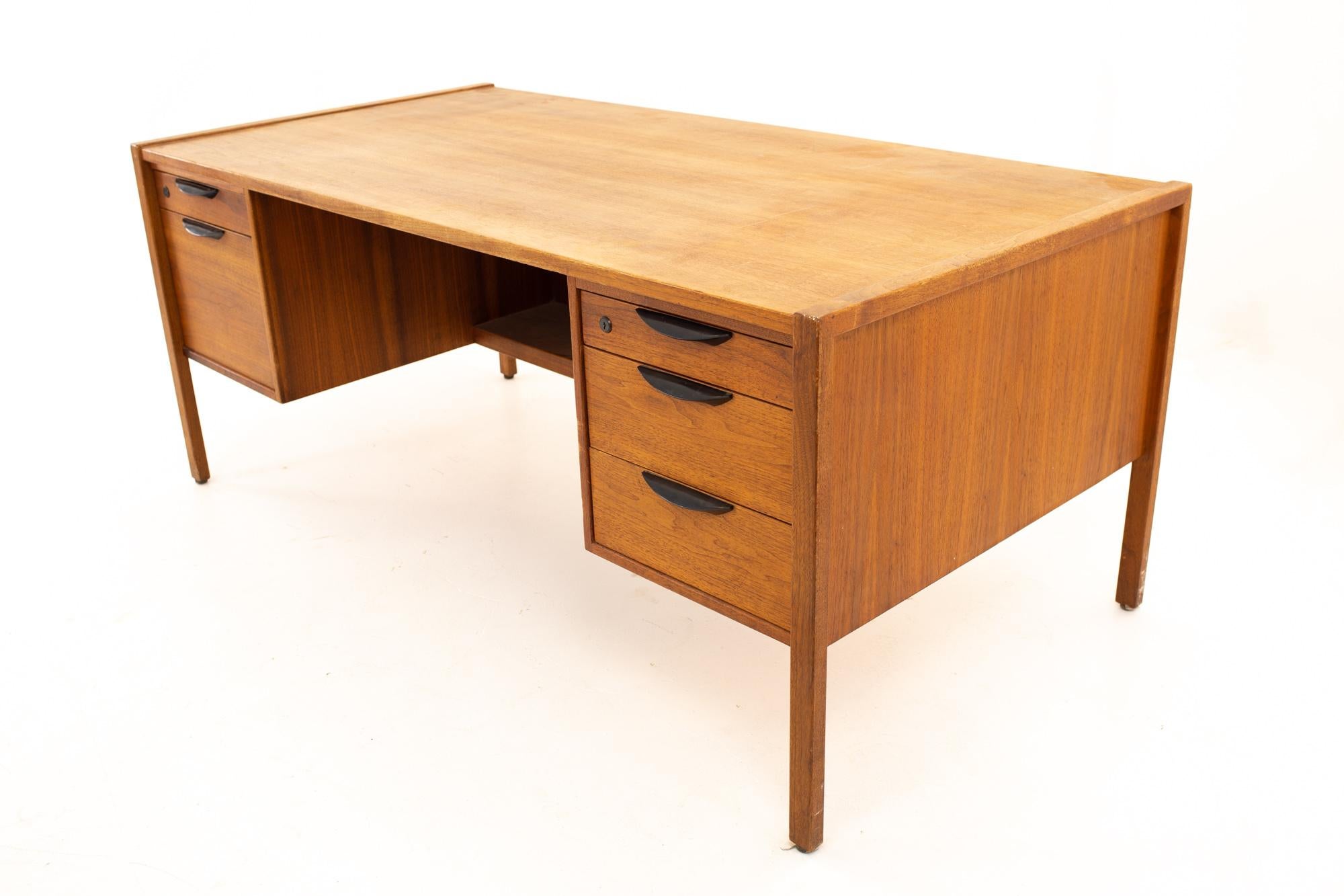 Jens Risom mid century 5 drawer walnut executive desk
Desk measures: 68 wide x 34.25 deep x 28.5 high

All pieces of furniture can be had in what we call restored vintage condition. That means the piece is restored upon purchase so it’s free of