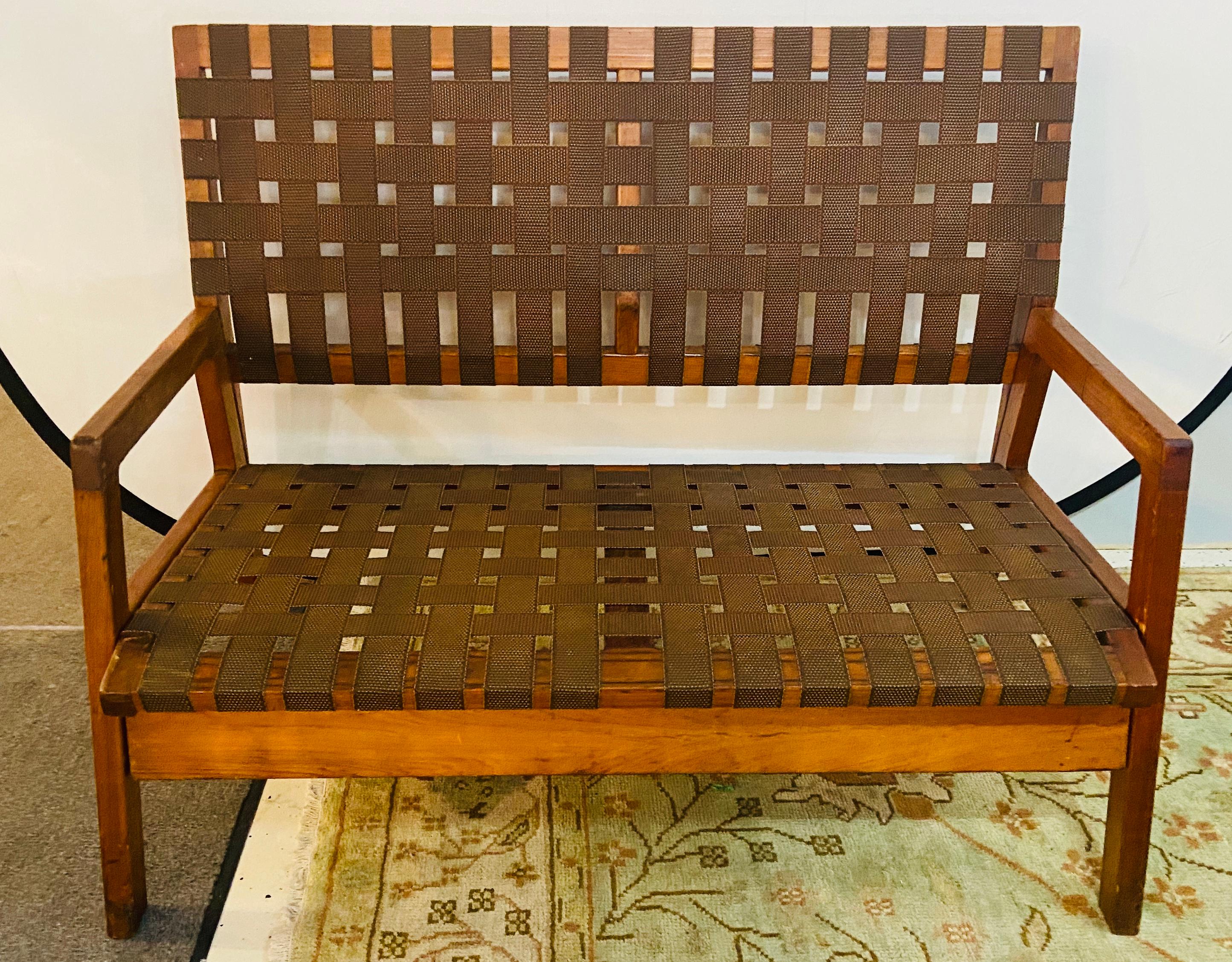 Mid-Century Modern Weaved Strap and Canvas Bench in the manner of Jens Risom
This large and sleek bench in the style of Jens Risom (an examplar of Mid-Century Modern design and one of the first to introduce the MCM design to the United States)  is