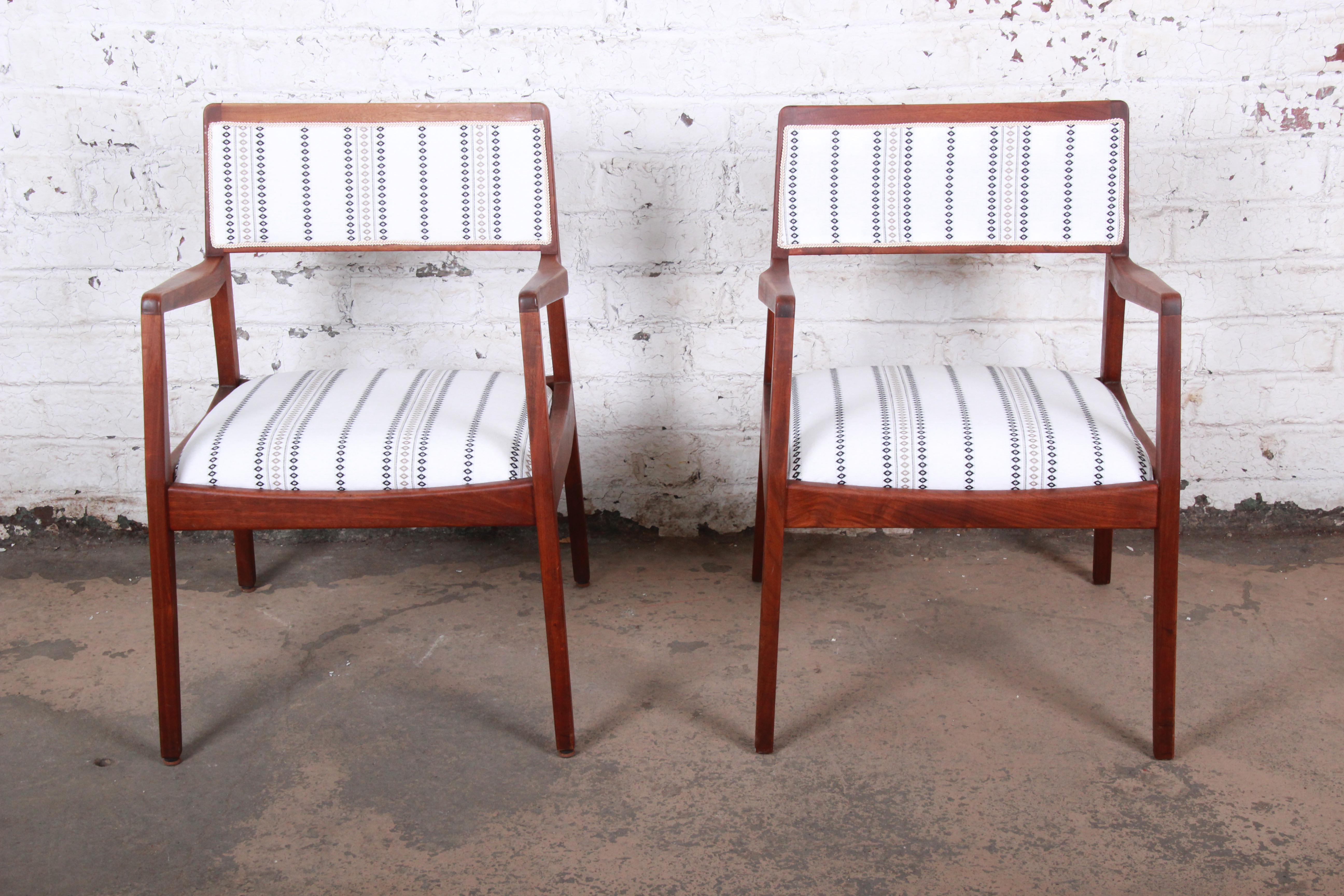 An exceptional and iconic pair of Mid-Century Modern sculpted walnut model C140 