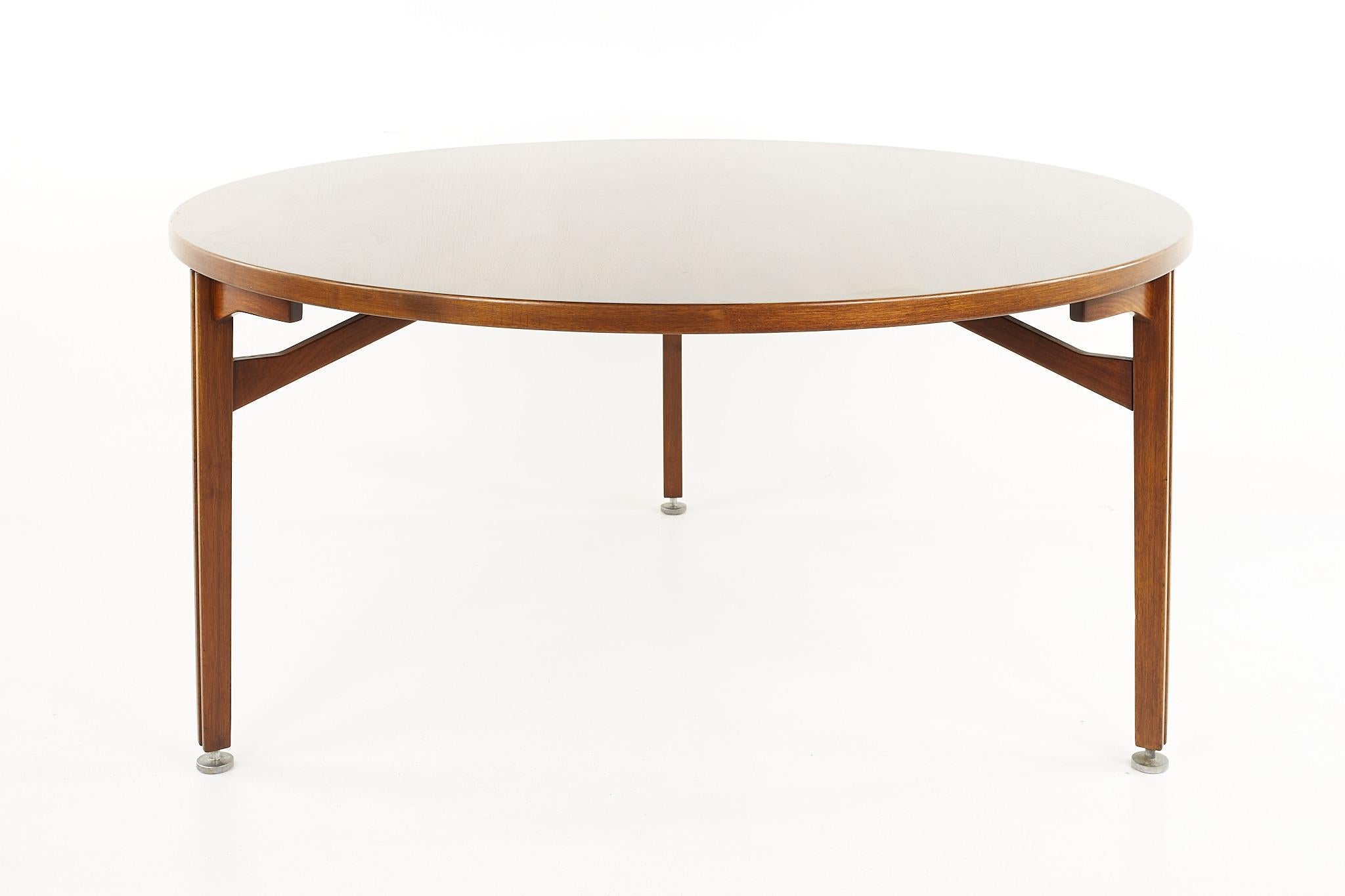 Jens Risom mid century round 3 leg walnut dining table

The table measures: 60 wide x 60 deep x 28.75 high, with a chair clearance of 27 inches 

All pieces of furniture can be had in what we call restored vintage condition. That means the piece