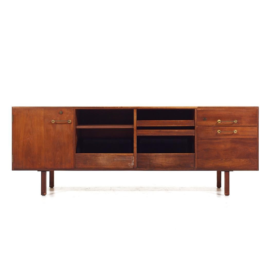 Jens Risom Mid Century Walnut and Brass Credenza

This credenza measures: 72 wide x 20.25 deep x 26.25 inches high

All pieces of furniture can be had in what we call restored vintage condition. That means the piece is restored upon purchase so it’s