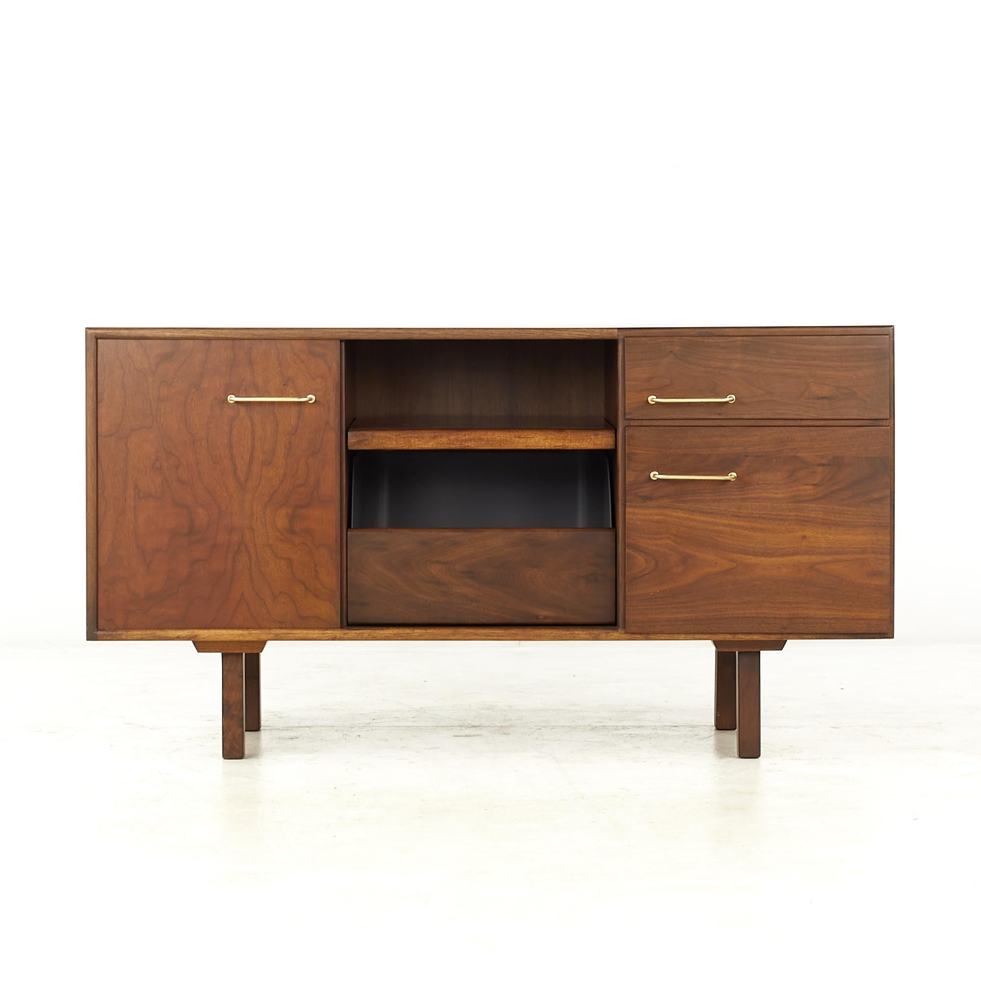 Jens Risom Mid Century Walnut and Brass Media Cabinet

This cabinet measures: 48 wide x 20 deep x 26 high

All pieces of furniture can be had in what we call restored vintage condition. That means the piece is restored upon purchase so it’s free of
