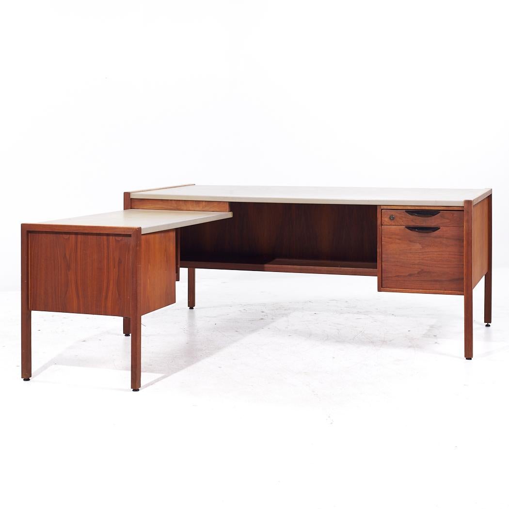Jens Risom Mid Century Walnut and Leather Top Corner Desk

This desk measures: 68 wide x 34 deep x 28.25 high, with a chair clearance of 27 inches
The total depth of the desk including the return is 72 inches

All pieces of furniture can be had in