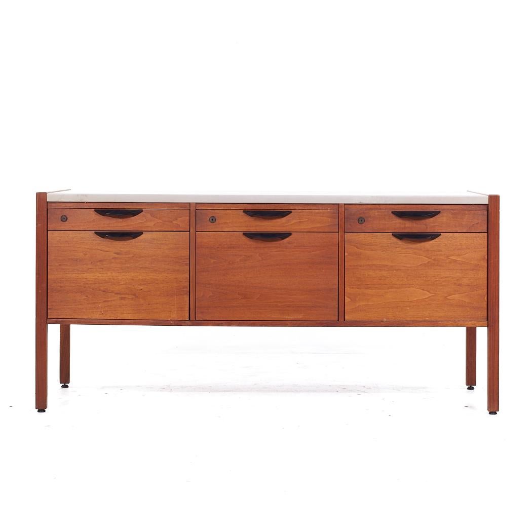 Jens Risom Mid Century Walnut and Leather Top Credenza

This credenza measures: 60 wide x 21 deep x 28.5 inches high

All pieces of furniture can be had in what we call restored vintage condition. That means the piece is restored upon purchase so