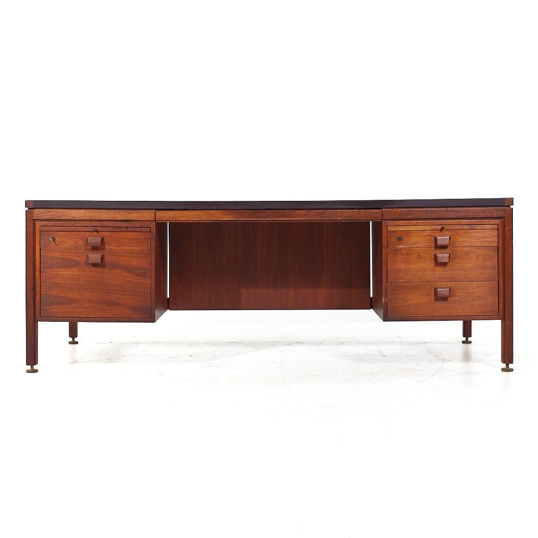Jens Risom Mid Century Walnut and Leather Top Executive Desk

This desk measures: 81.25 wide x 36 deep x 28.75 high, with a chair clearance of 25 inches

All pieces of furniture can be had in what we call restored vintage condition. That means the