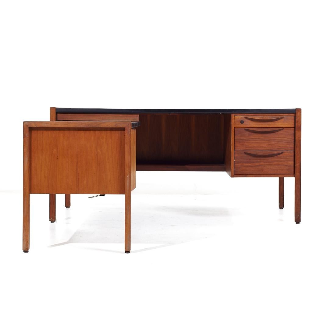 Jens Risom Mid Century Walnut Corner Desk with Left Return

This desk measures: 62 wide x 28 deep x 28.5 high, with a chair clearance of 27.25 inches
The return measures: 62 wide x 65.5 deep x 25.5 inches high, with a chair clearance of 24.25