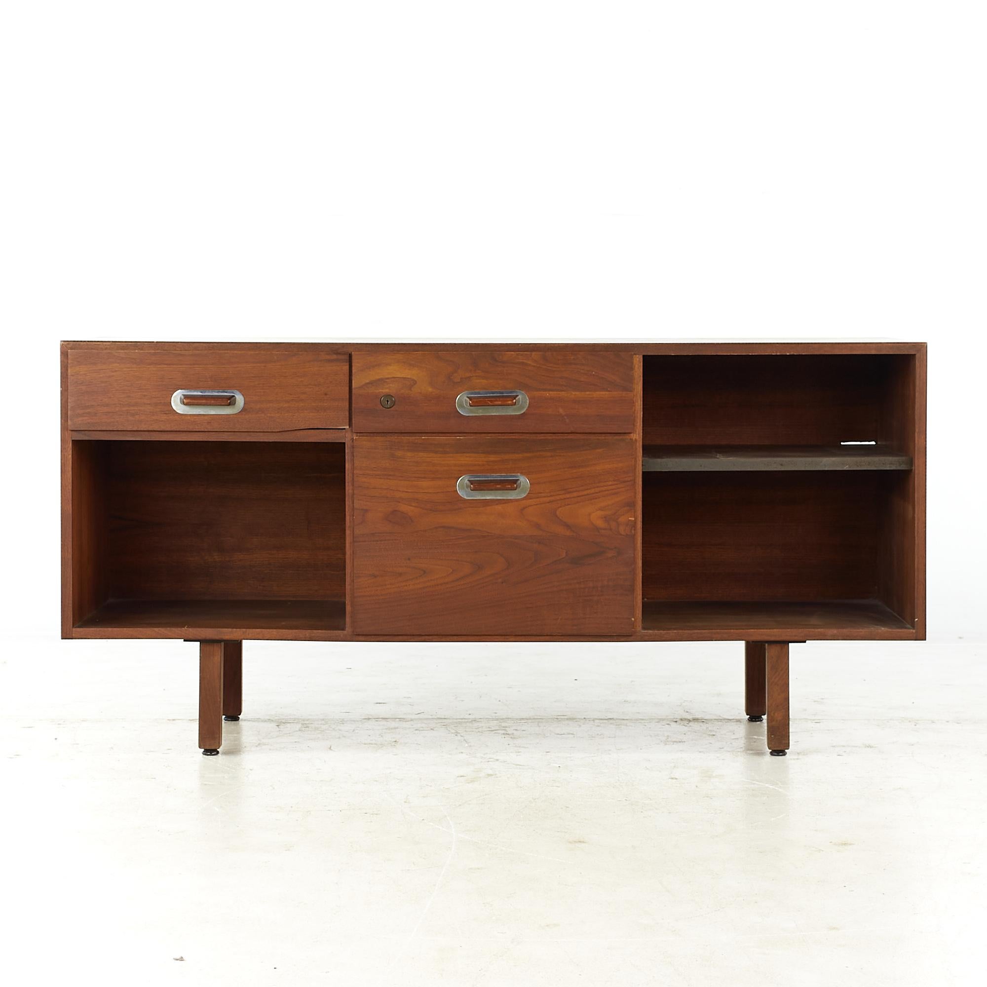 Jens Risom mid-century walnut credenza.

This credenza measures: 54.25 wide x 20.25 deep x 26.25 inches high.

All pieces of furniture can be had in what we call restored vintage condition. That means the piece is restored upon purchase so it’s