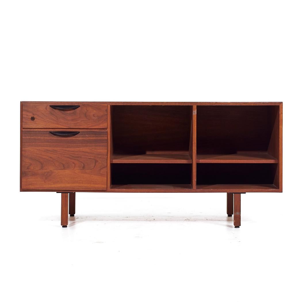 Jens Risom Mid Century Walnut Credenza

This credenza measures: 54.25 wide x 20.25 deep x 26.25 inches high

All pieces of furniture can be had in what we call restored vintage condition. That means the piece is restored upon purchase so it’s free