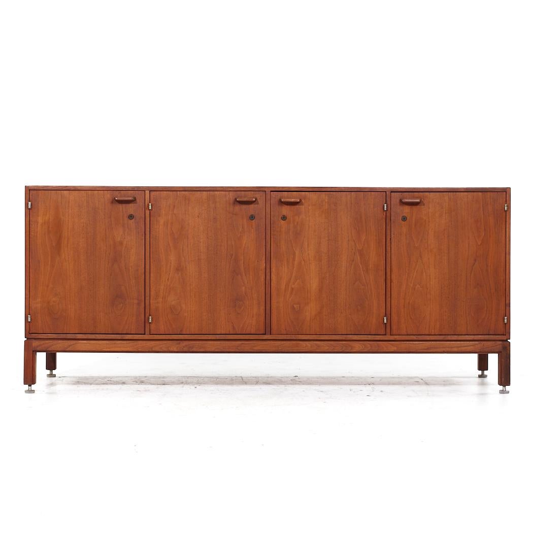 Jens Risom Mid Century Walnut Credenza

This credenza measures: 77.75 wide x 20 deep x 33.25 inches high

All pieces of furniture can be had in what we call restored vintage condition. That means the piece is restored upon purchase so it’s free of