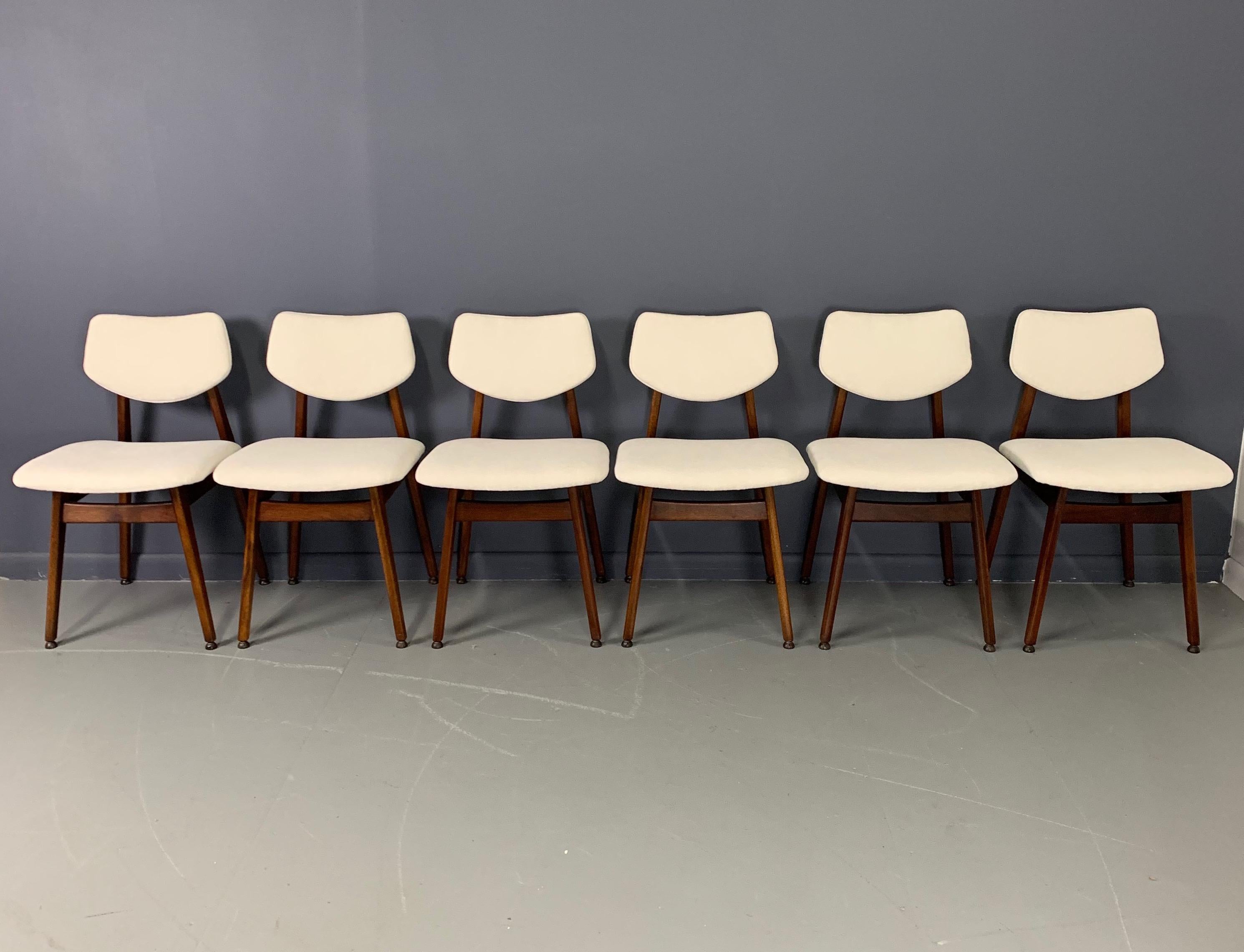 Set of six model C276 dining chairs in walnut by Jens Risom. Newly refinished and reupholstered in a lovely white textured velvet.