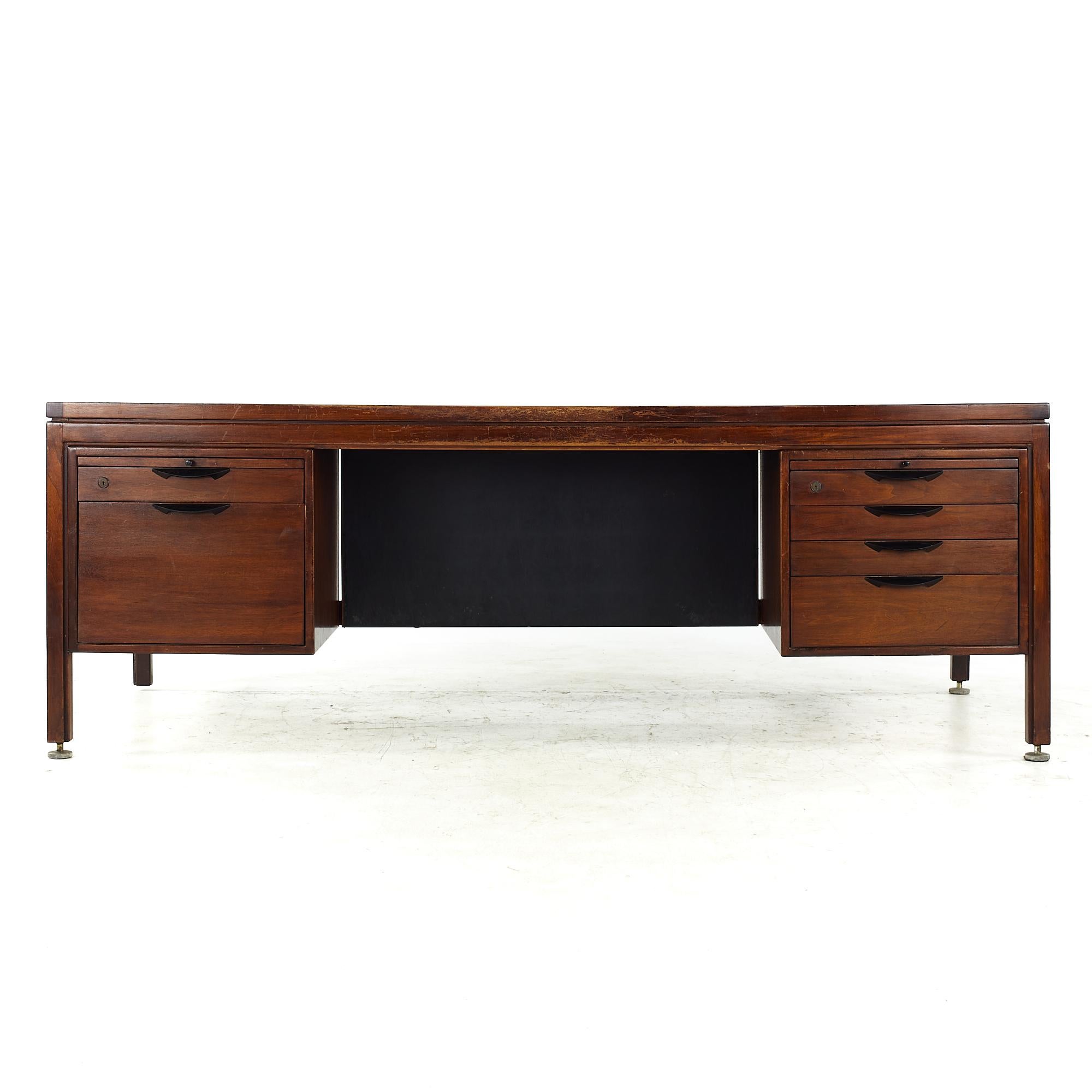 Jens Risom midcentury walnut executive desk

This desk measures: 81.5 wide x 36 deep x 29 high, with a chair clearance of 25.25 inches

All pieces of furniture can be had in what we call restored vintage condition. That means the piece is