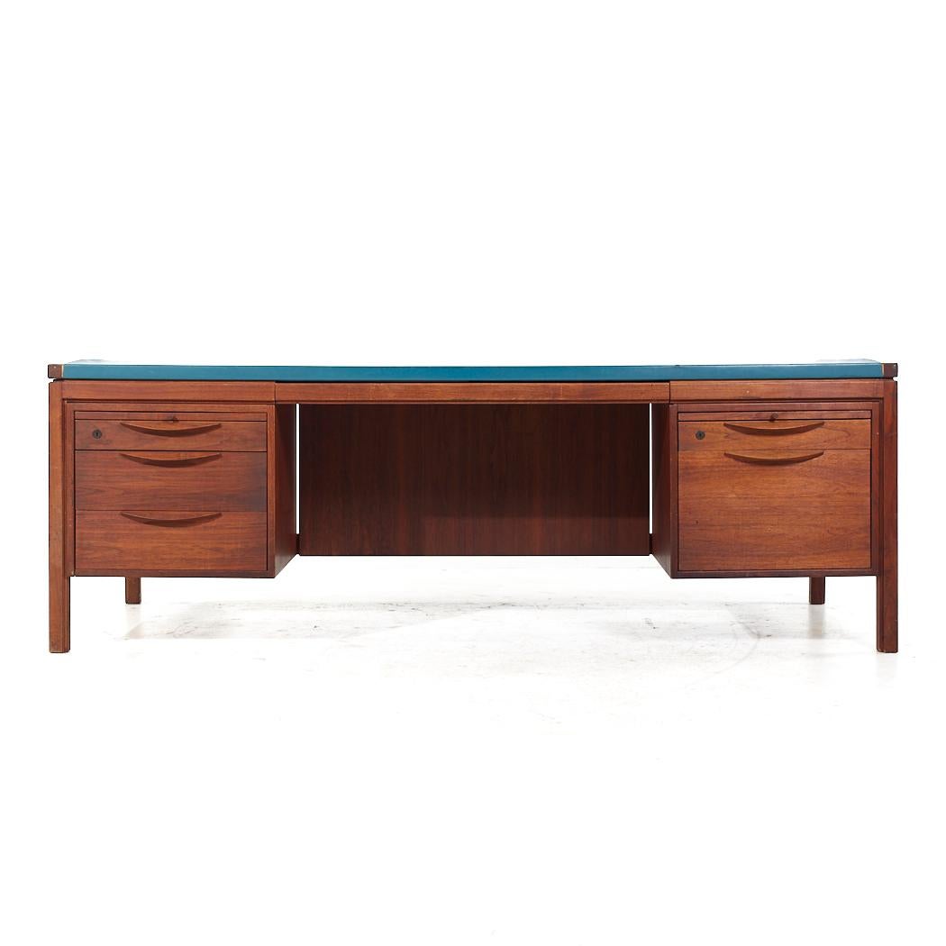 Jens Risom Mid Century Walnut Executive Desk

This desk measures: 81.25 wide x 36 deep x 27.5 high, with a chair clearance of 23.75 inches

All pieces of furniture can be had in what we call restored vintage condition. That means the piece is