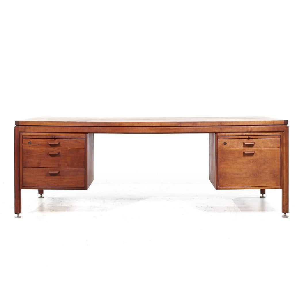 Jens Risom Mid Century Walnut Executive Desk

This desk measures: 81.25 wide x 36 deep x 29 high, with a chair clearance of 25 inches

All pieces of furniture can be had in what we call restored vintage condition. That means the piece is restored