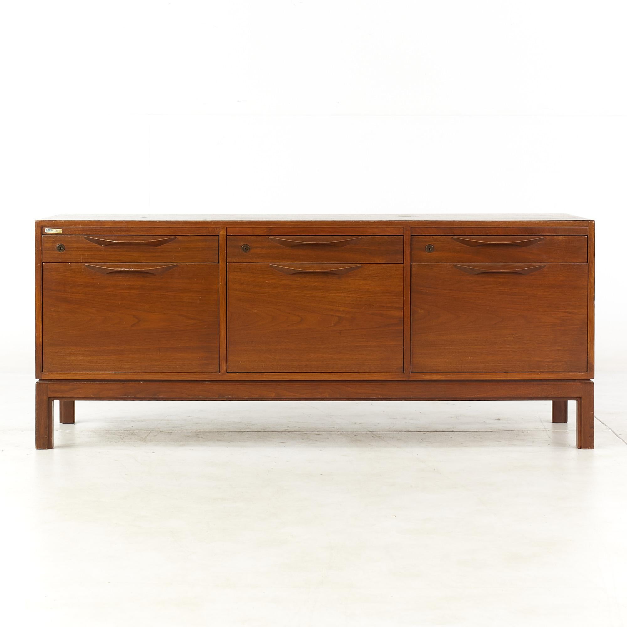 Jens Risom mid century walnut file cabinet Credenza.

This credenza measures: 58.5 wide x 20 deep x 24 inches high.

All pieces of furniture can be had in what we call restored vintage condition. That means the piece is restored upon purchase so