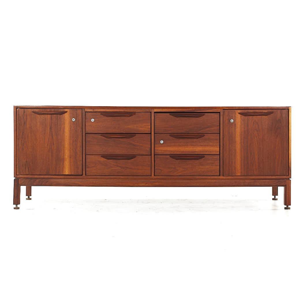 Jens Risom Mid Century Walnut File Credenza

This credenza measures: 75.25 wide x 20 deep x 28 inches high

All pieces of furniture can be had in what we call restored vintage condition. That means the piece is restored upon purchase so it’s free of