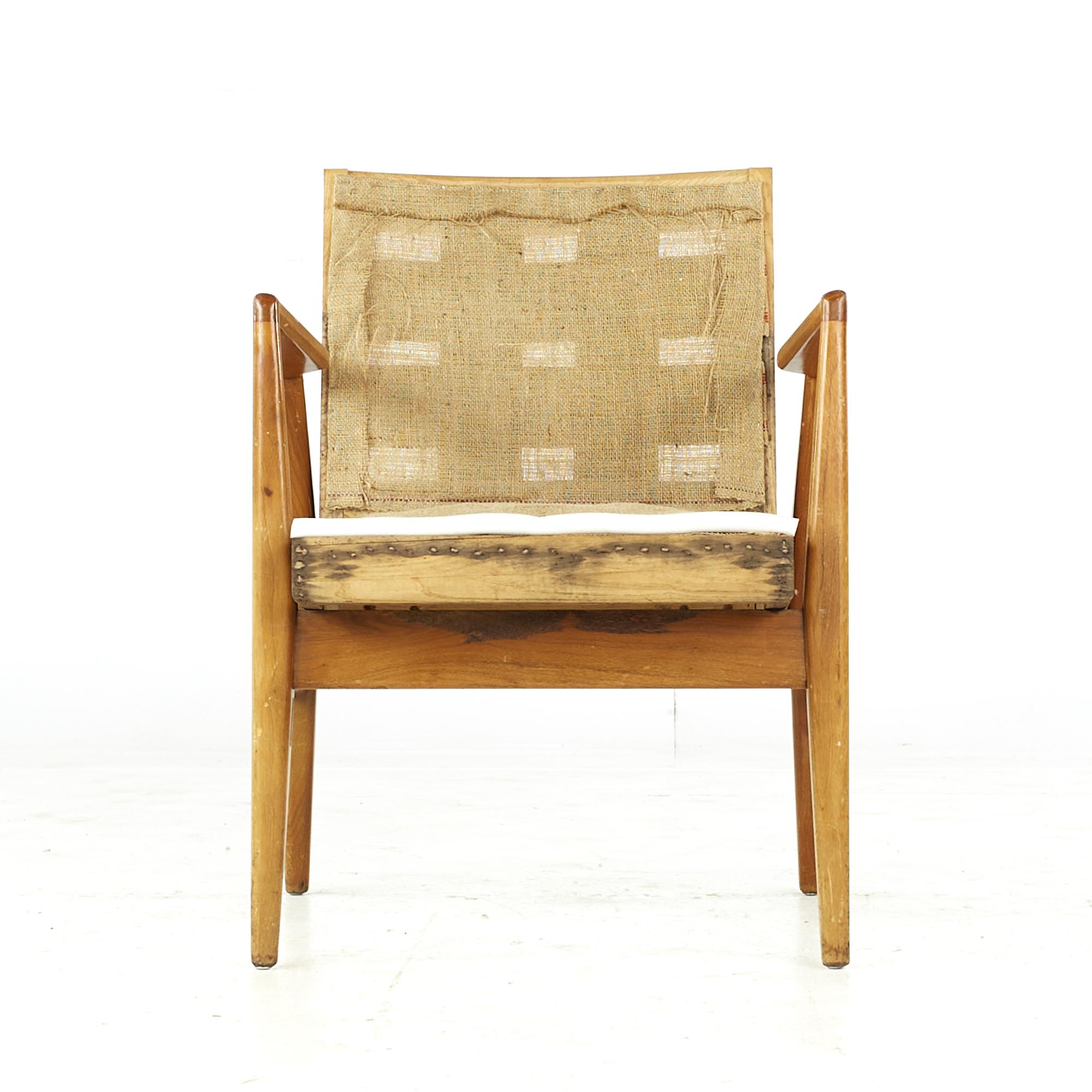 Jens Risom midcentury walnut lounge chair.

This chair measures: 23.25 wide x 24 deep x 31 high, with a seat height of 17.5 and arm height/chair clearance 26 inches.

All pieces of furniture can be had in what we call restored vintage condition.