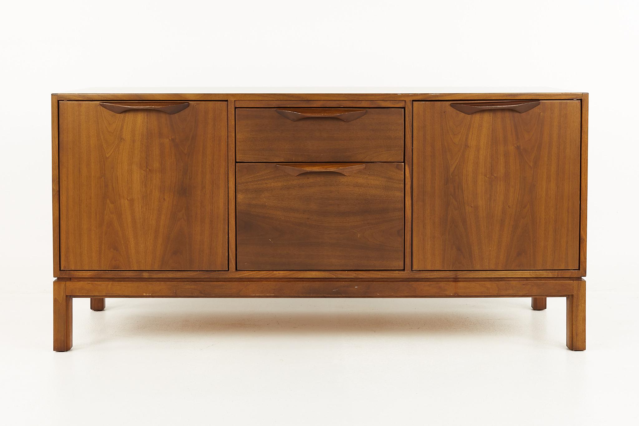 Jens Risom mid century walnut sideboard credenza

This credenza measures: 56.5 wide x 21 deep x 27.75 inches high

All pieces of furniture can be had in what we call restored vintage condition. That means the piece is restored upon purchase so