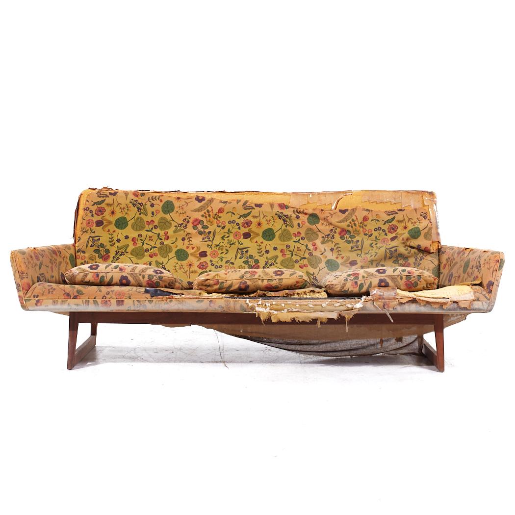 Jens Risom Mid Century Walnut Sled Leg Sofa

This sofa measures: 85 wide x 32 deep x 31 inches high, with a seat height of 19 and arm height of 21 inches

All pieces of furniture can be had in what we call restored vintage condition. That means the