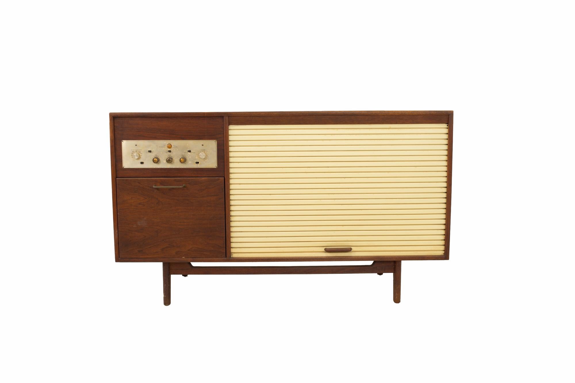 Jens Risom midcentury walnut tambour door stereo console credenza
Credenza measures: 54.25 wide x 21.5 deep x 31.5 high

All pieces of furniture can be had in what we call restored vintage condition. That means the piece is restored upon purchase