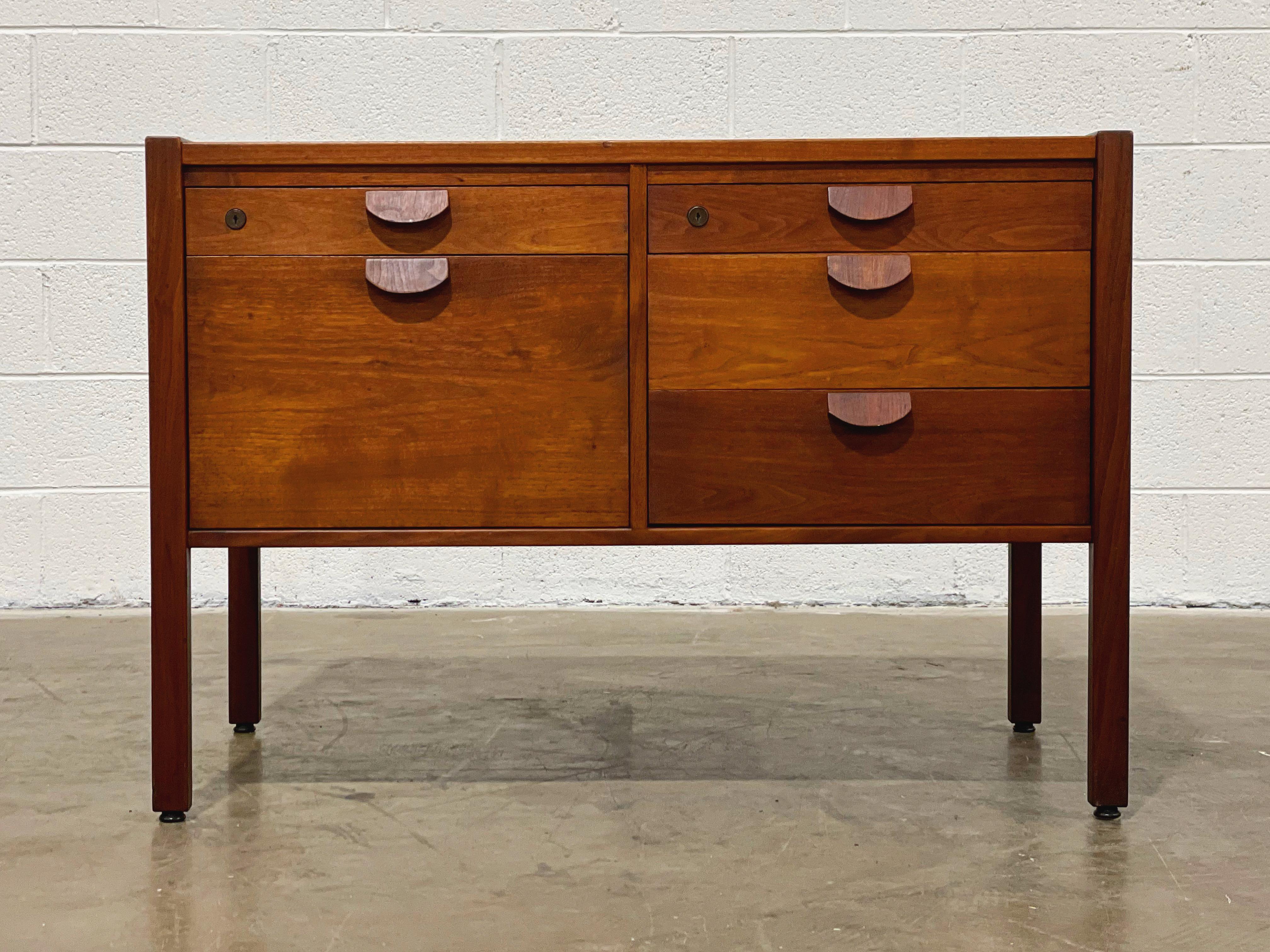 Mid-century credenza filing cabinet by Jens Risom in American black walnut, circa 1965. Desirable solid walnut 