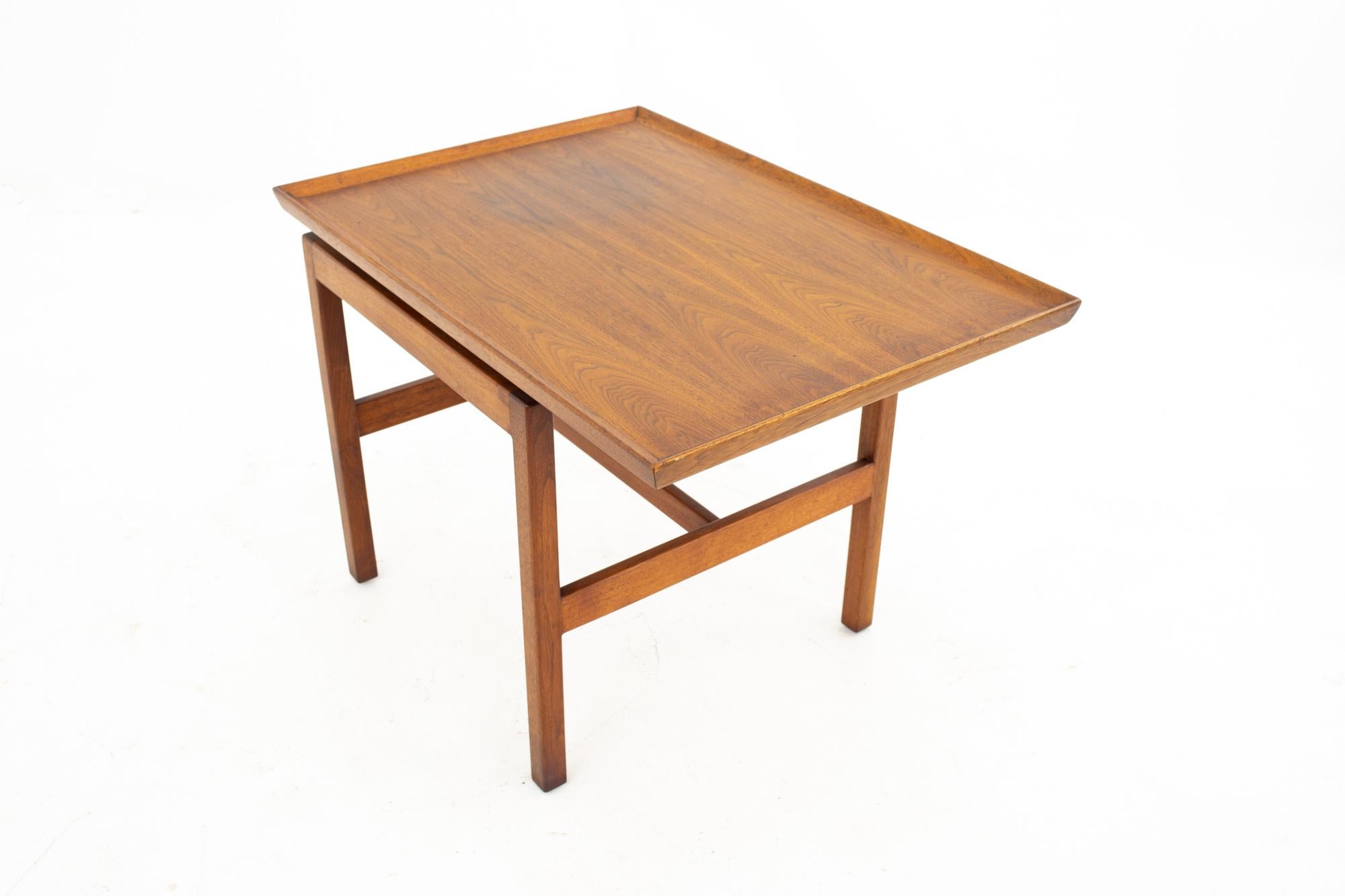 Jens Risom Mid Century walnut side end table
Size: 21 wide x 30 deep x 22 high  

This piece is available in what we call restored vintage condition. Upon purchase it is fixed so it’s free of watermarks, chips or deep scratches with color loss; as