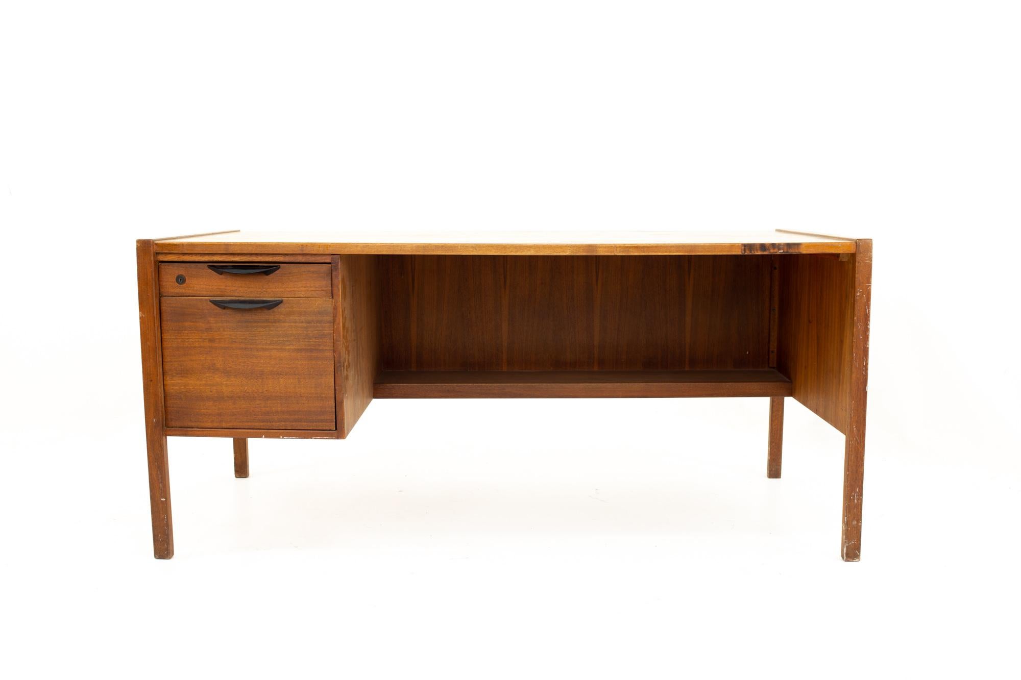 Jens Risom Mid Century walnut single sided 2-drawer desk
Desk measures: 62 wide x 28 deep x 28 high

All pieces of furniture can be had in what we call restored vintage condition. This means the piece is restored upon purchase so it’s free of