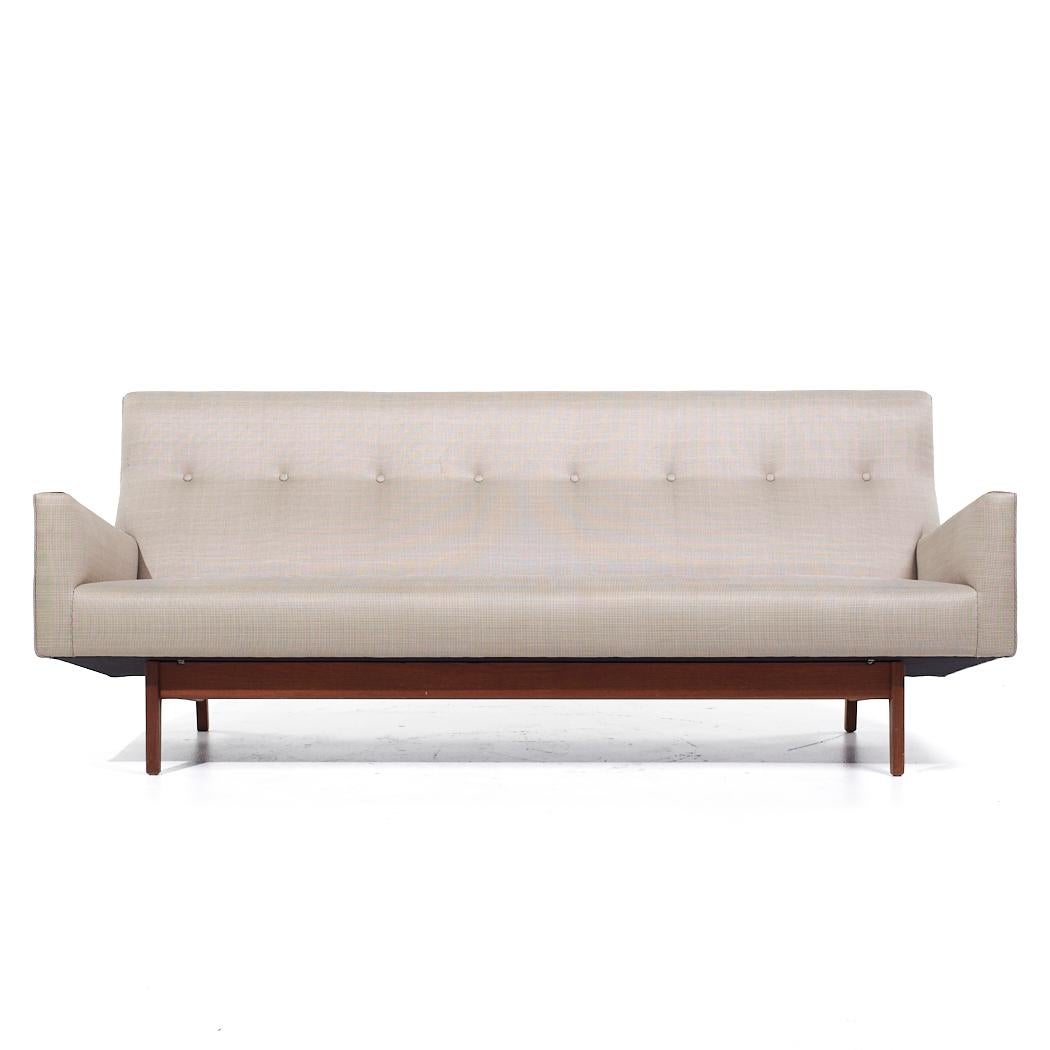 Jens Risom Model U-150 Mid Century Walnut Bracket Back Sofa

This sofa measures: 80 wide x 30 deep x 32.5 inches high, with a seat height of 23.75 and arm height of 16.5 inches

All pieces of furniture can be had in what we call restored vintage