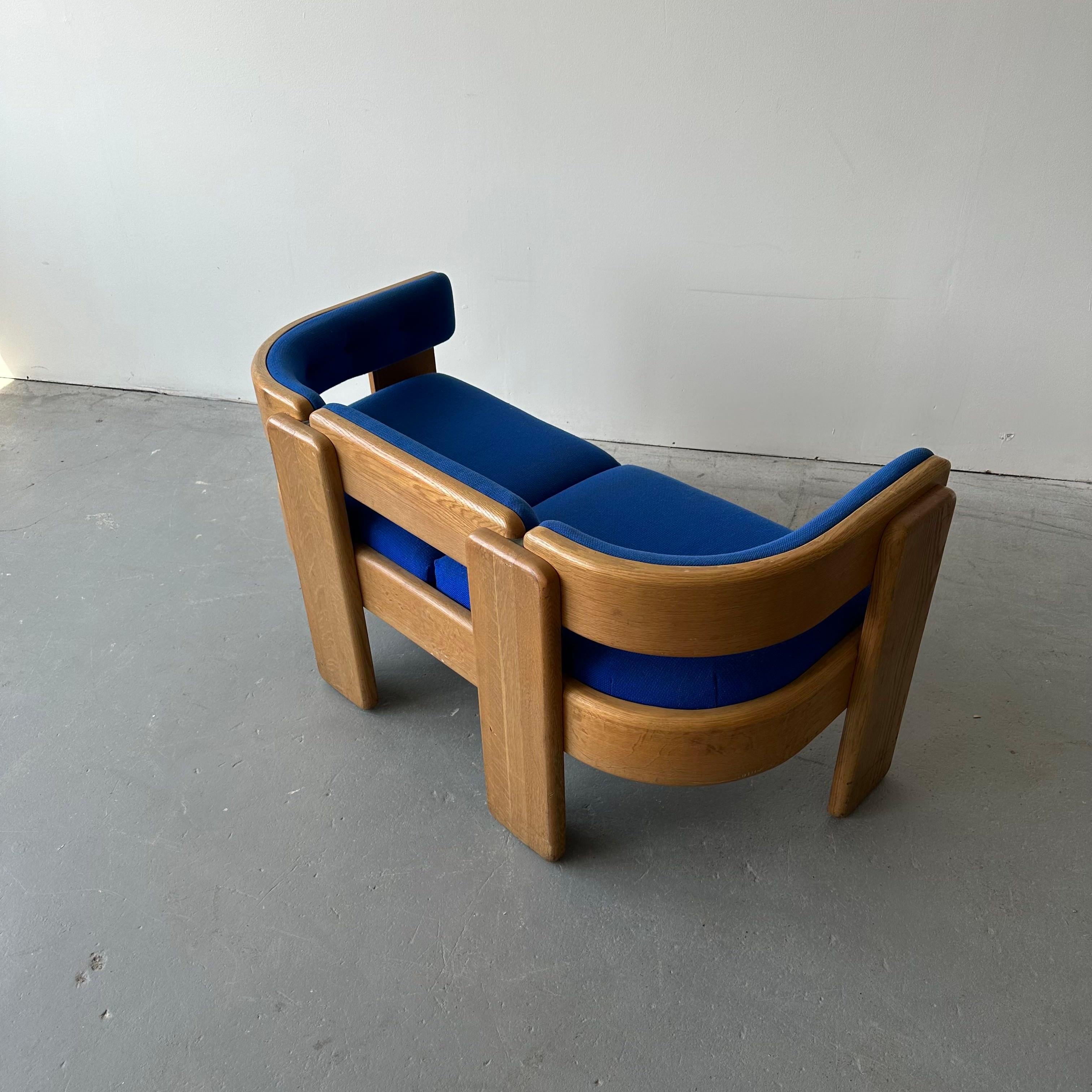 for Marble Furniture c. 1960s, signed. There are flaws on the oak frame consistent with heavy use and the piece’s age, but overall they lend to a great vintage patina. The wear includes small cracks, chips to the oak, dents, and scratches. The