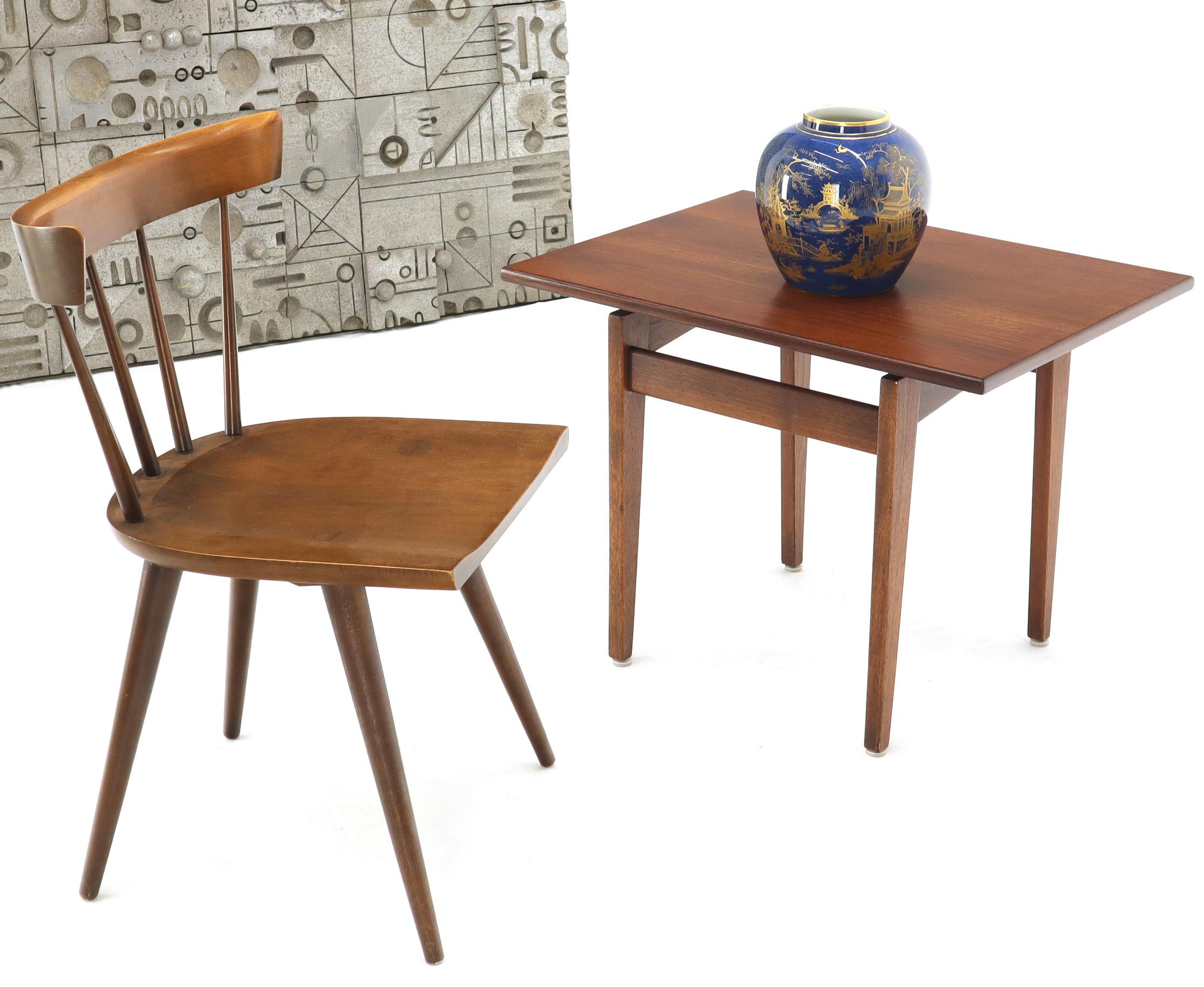 Mid-Century Modern oiled walnut side table by Jens Risom. Tapered solid walnut legs construction. Oiled walnut finish.