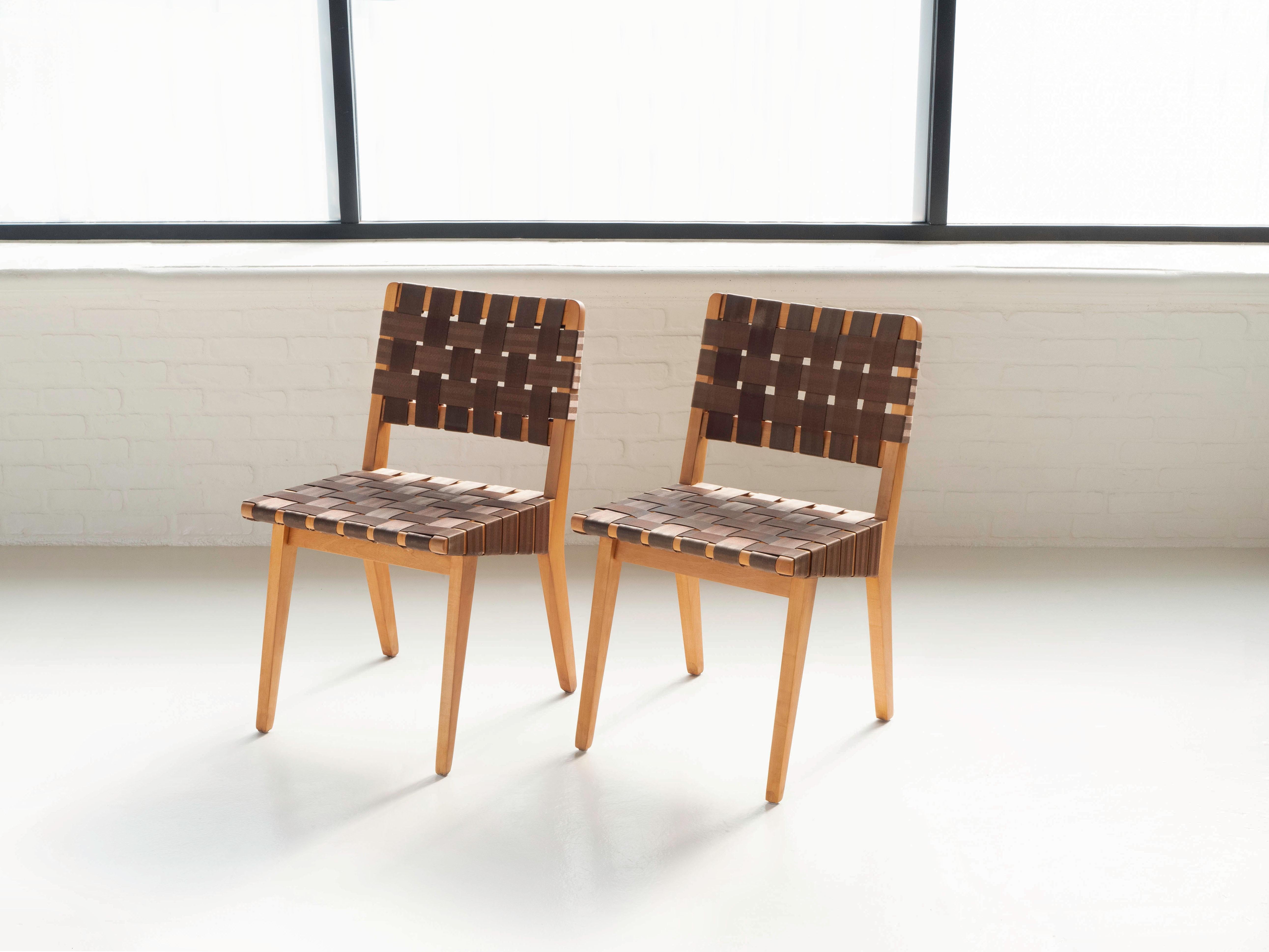 Pair of early Knoll side chairs by designer Jens Risom. Circa 1940's. 

In original condition, with wear shown throughout and near the bottom of the legs. The chairs have been lightly cleaned, the webbing is still strong and supportive. Model