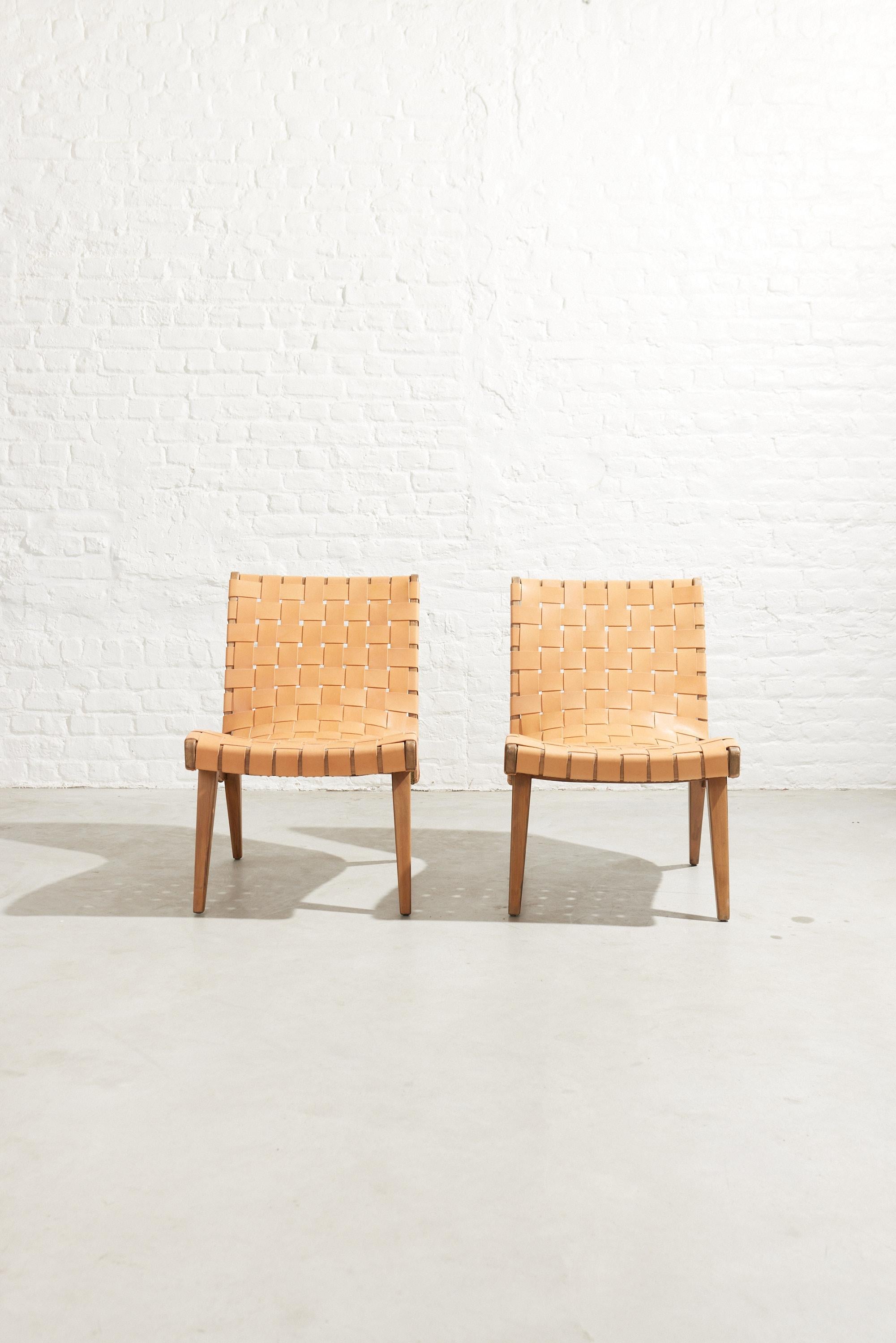 Pair of lounge chairs designed by Jens Risom in 1941. Jens Risom’s designs were the first pieces conceived for and manufactured by Knoll in the USA. Due to wartime material restrictions, the lounge chair was originally constructed of simple maple