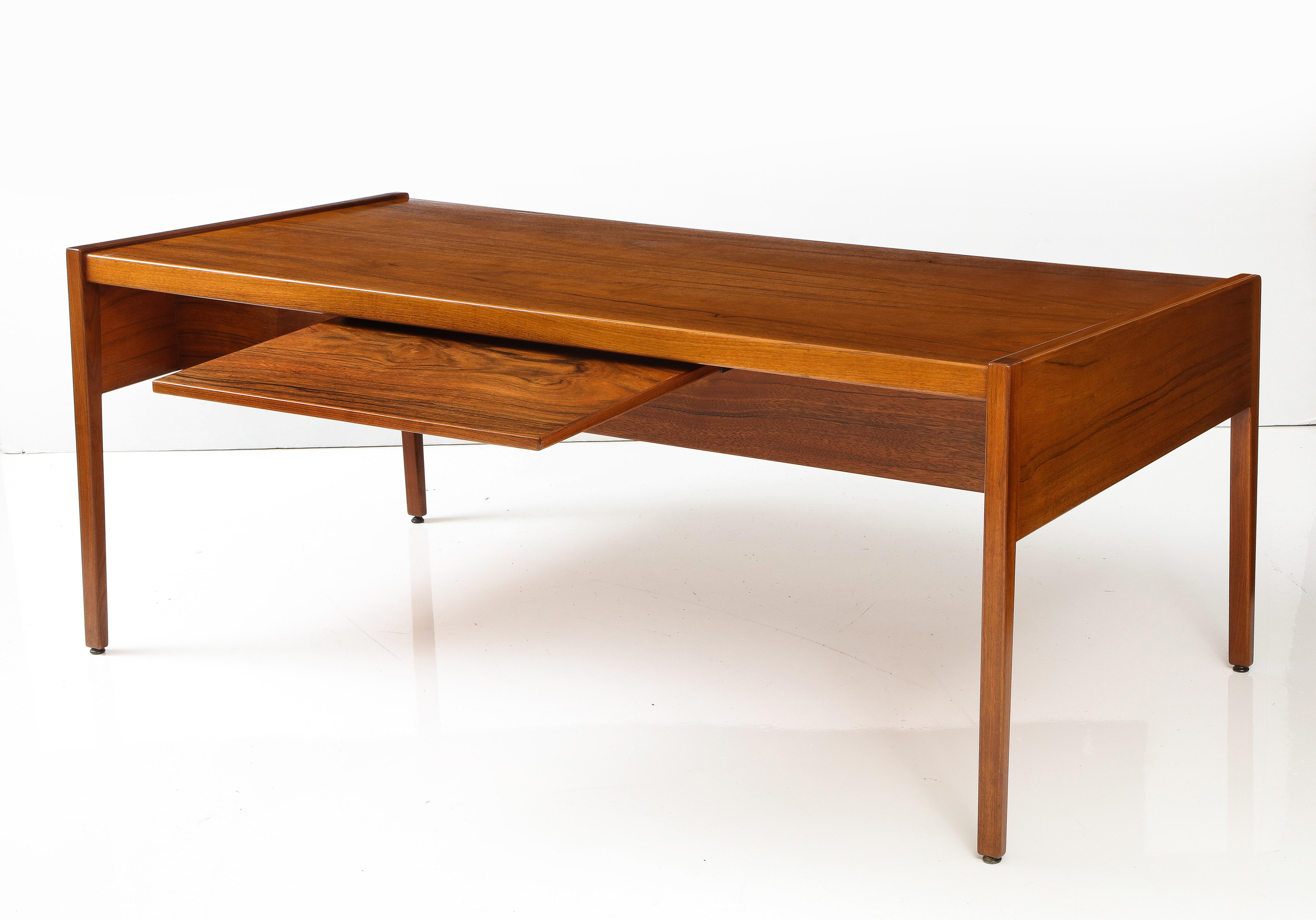 1970's mid-century modern Paldao wood executive desk designed by Jens Risom, with two drawers and two pull out trays with aluminum handles and pull out back large tray, fully restored with minor wear and patina due to age and use.