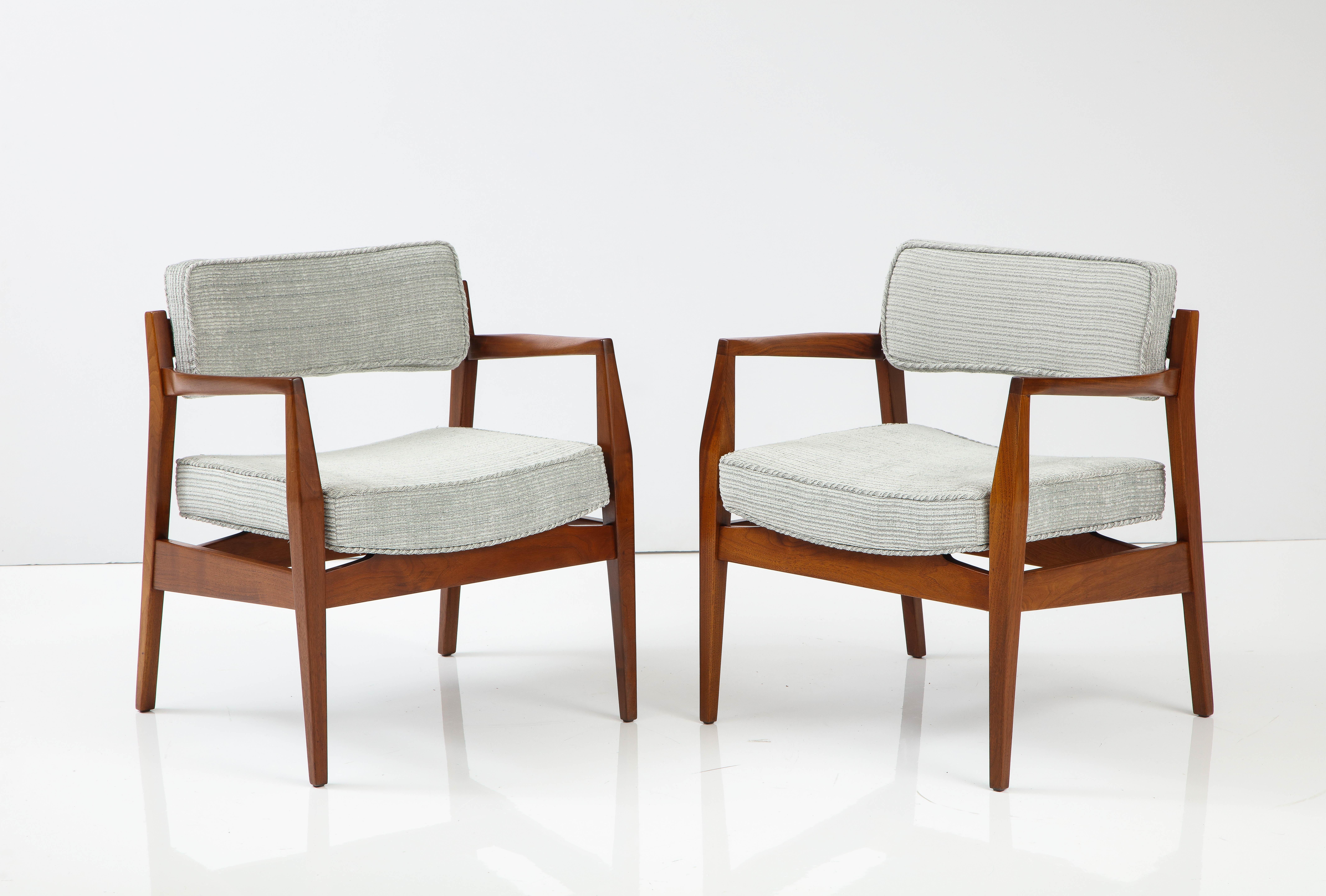 Stunning pair of 1960's Mid-Century Modern solid walnut armchairs designed by Jens Risom, fully restored and re-upholstered.