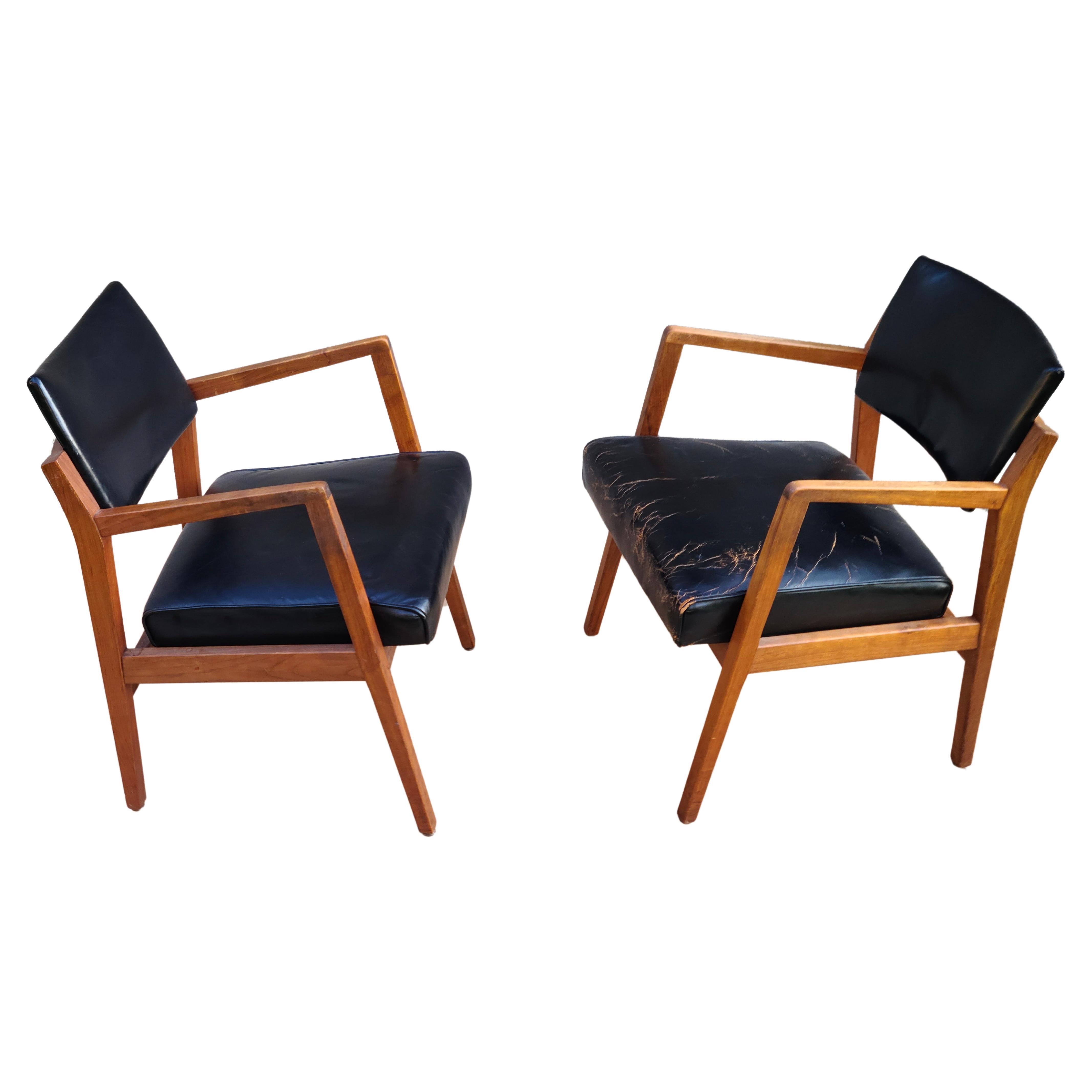 Set of 2 Arm Chairs by Jens Risom.
Walnut Frames. Vintage Leather seat and backrest.

