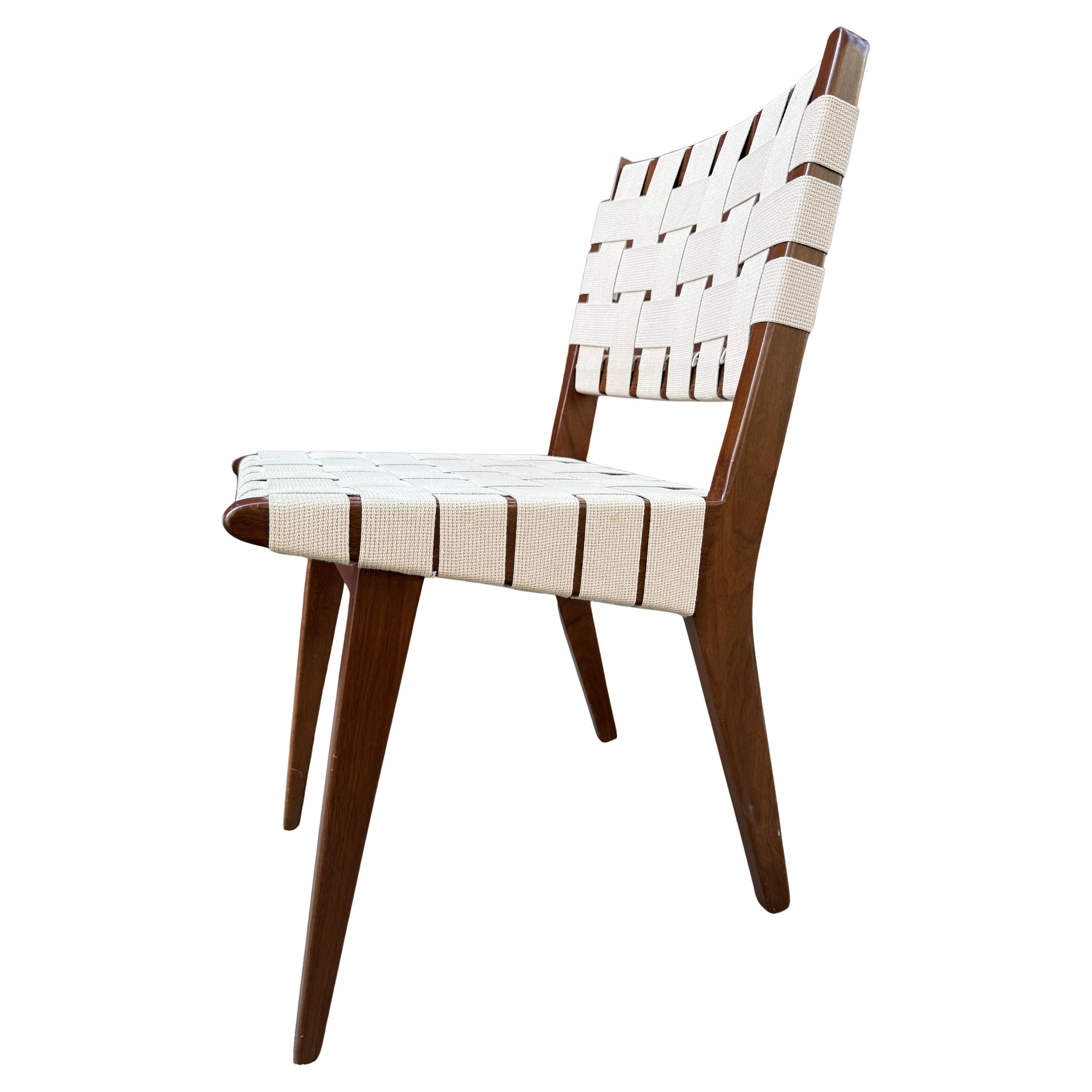 Knoll Jens Risom chairs. 
Simple classic and honest design made this side or dining chair so popular that its still in production today. Made from solid walnut wood and natural cotton strapping. 

  