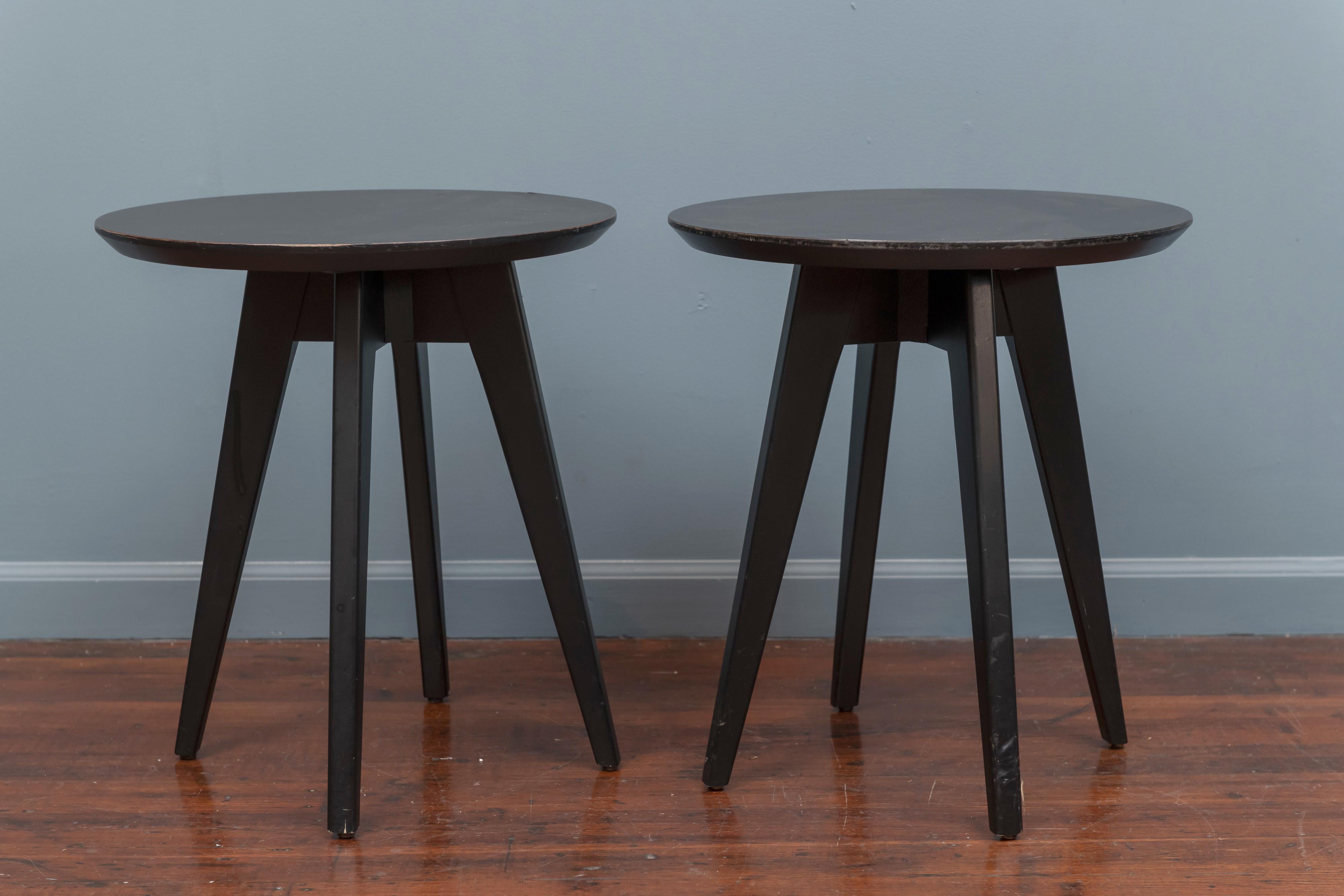 Jens Risom design pair of black lacquered side tables with black laminate tops for Knoll. 
In good used condition with one small repaired chip seen in picture 4.