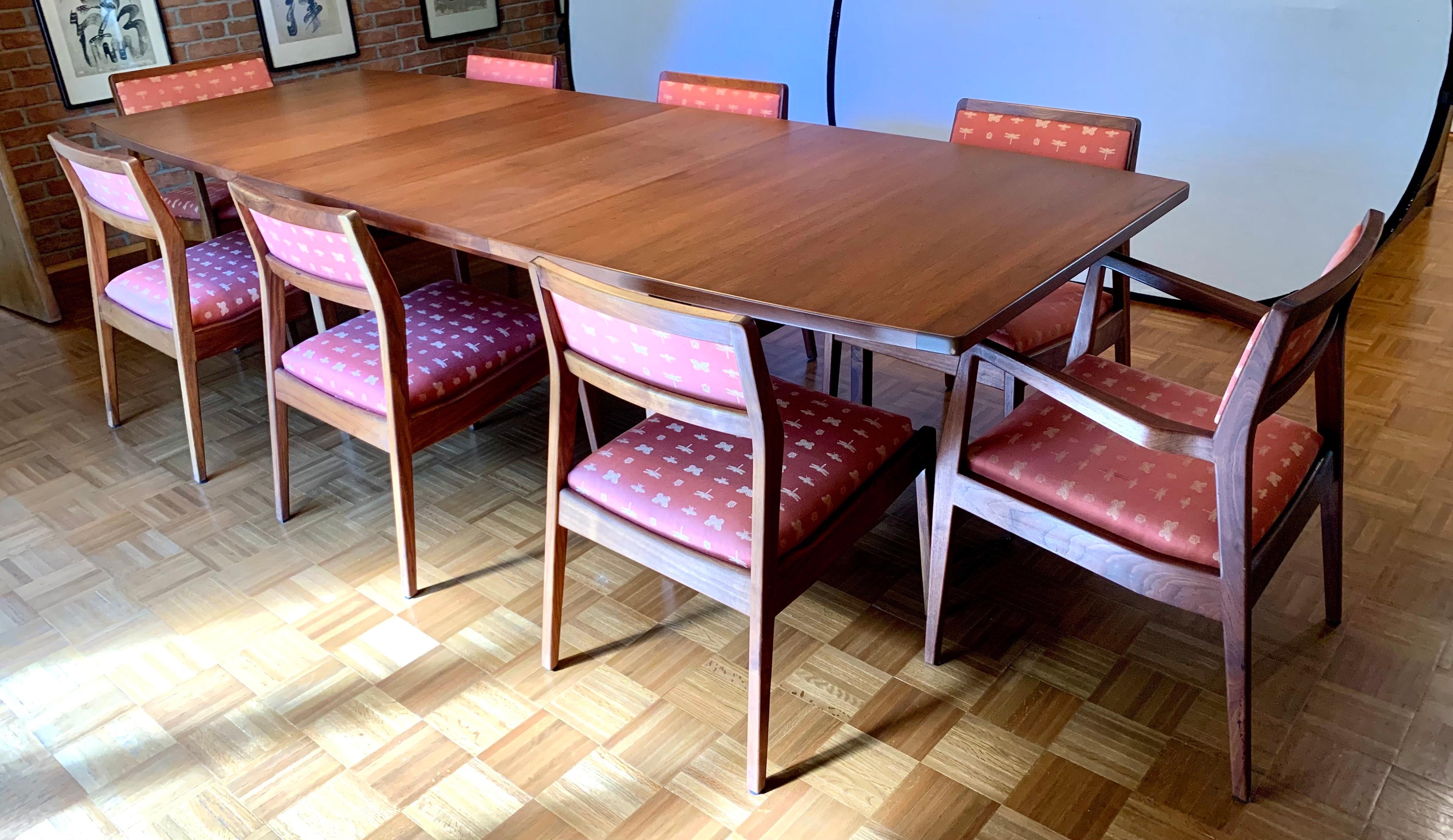 Magnificent signed Jens Risom expandable dining room set includes Jens Risom designed boat table for dining room or conference room and eight matching chairs, two arms and six side chairs. Two leaves that measure 18