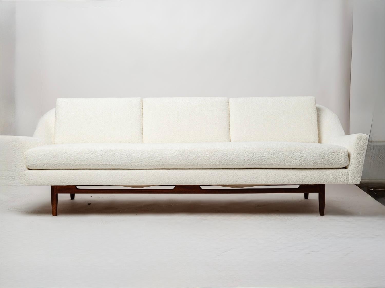 Elevate your space with this rare Jens Risom Model 2516 Sculptural Sofa, a mid-century icon celebrated for its graceful curves and impeccable craftsmanship.

This piece showcases beautiful, flowing lines that wrap the sitter in comfort while