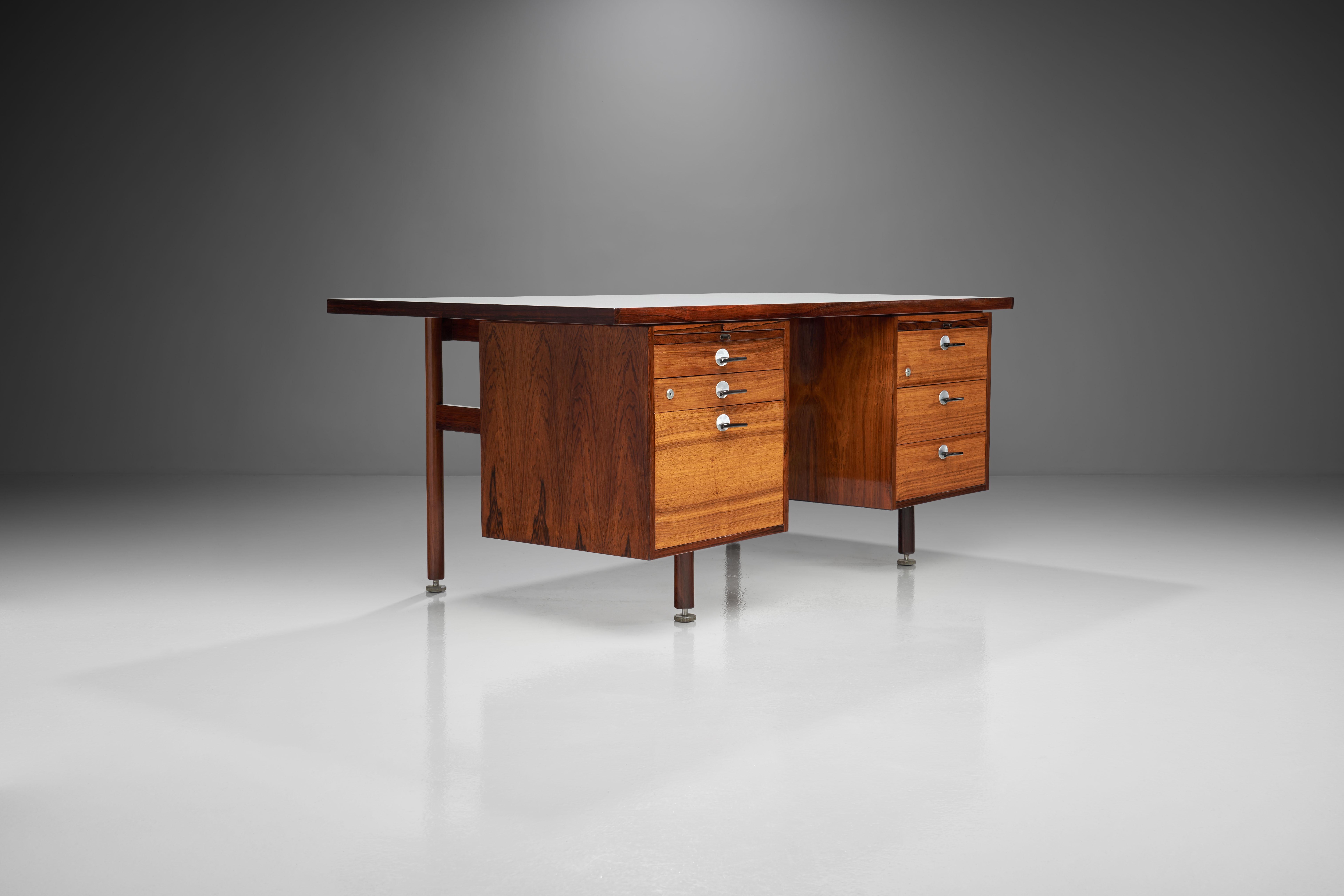 Jens Risom: wood desk, manufactured by Risom Design. 1960s. 

This nicely shaped Jens Risom desk has a well sized desktop, two drawer units with drawers and a pull-out leaf with glass top on each side. An internal lock allows you to lock the