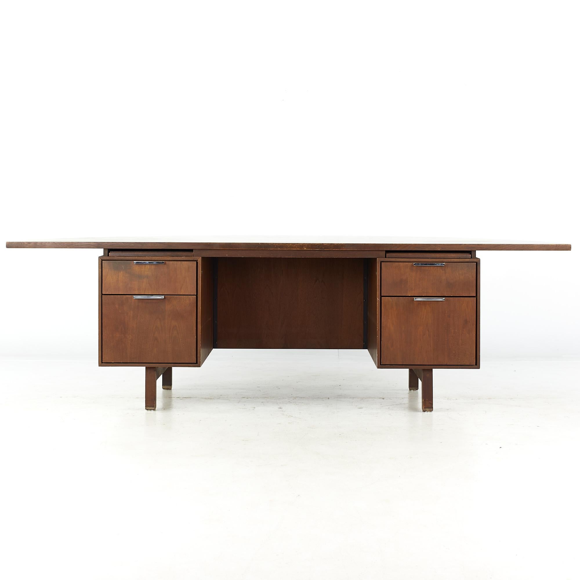Jens Risom style mid-century half circle walnut executive desk.

This desk measures: 95.5 wide x 47.5 deep x 29 high, with a chair clearance of 26.25 inches.

All pieces of furniture can be had in what we call restored vintage condition. That